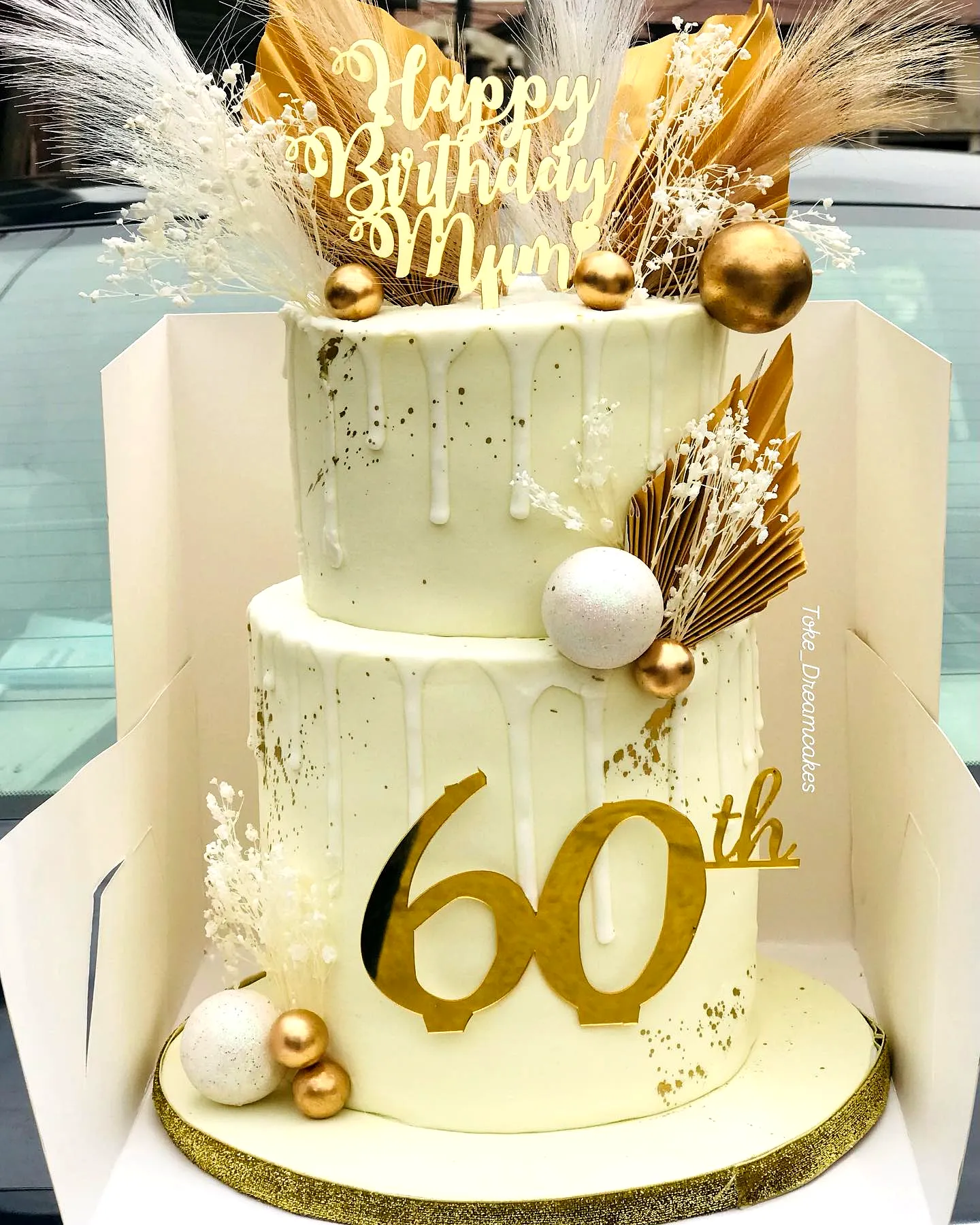Elegant 60th Birthday Cake with Gold Glitter and Dried Floral Decor