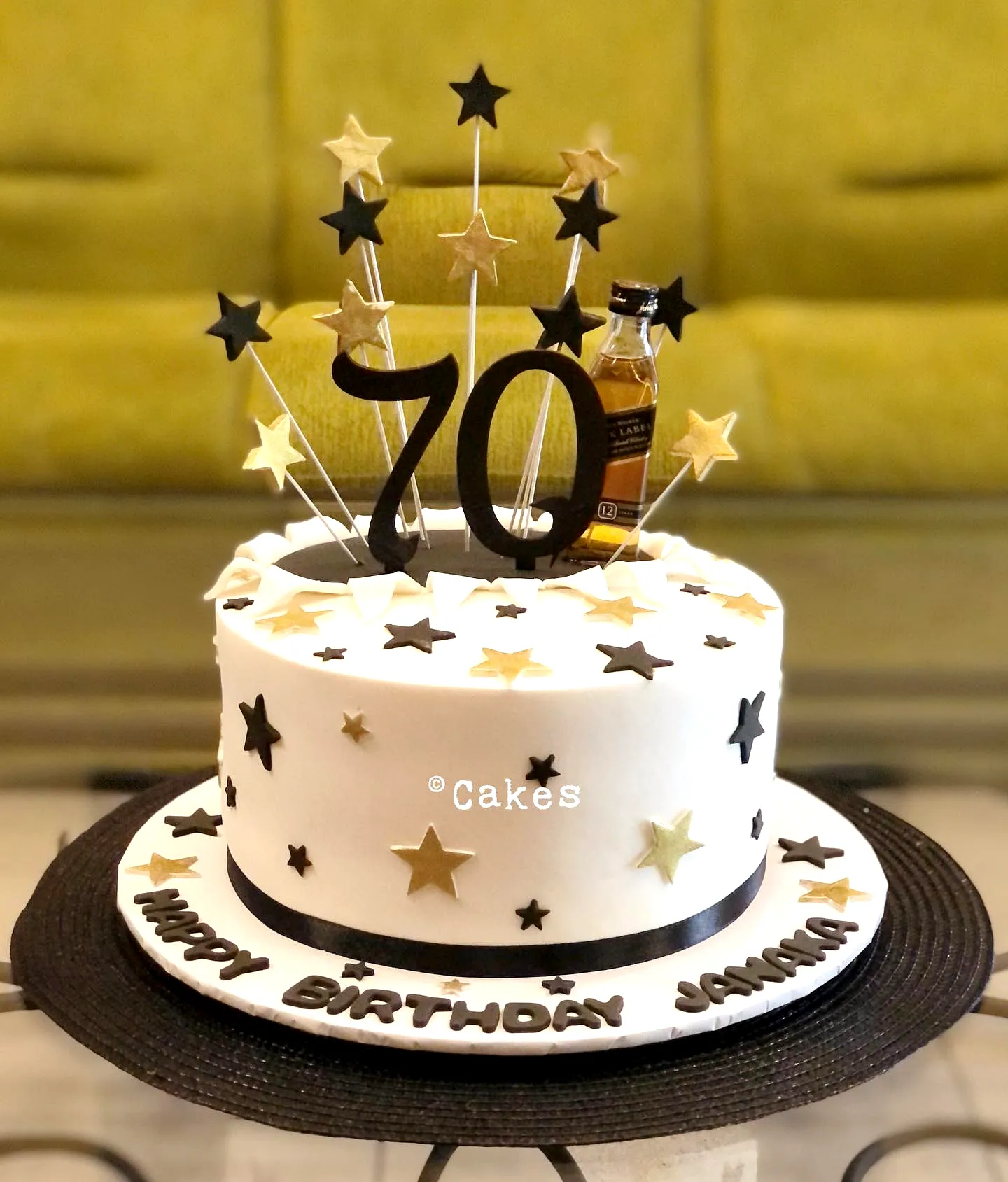 Elegant 70th Birthday Cake with Modern Gold and Black Decorations