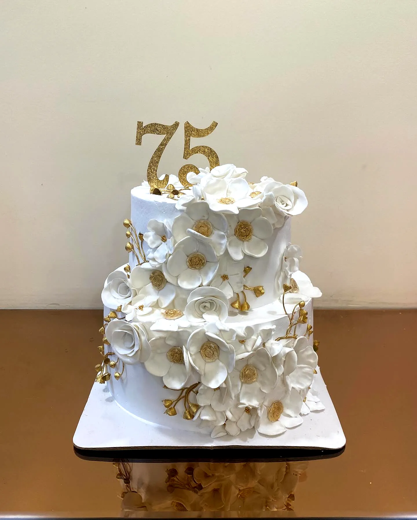 Elegant 75th Birthday Cake Inspiration with Floral Accents and Gold Details