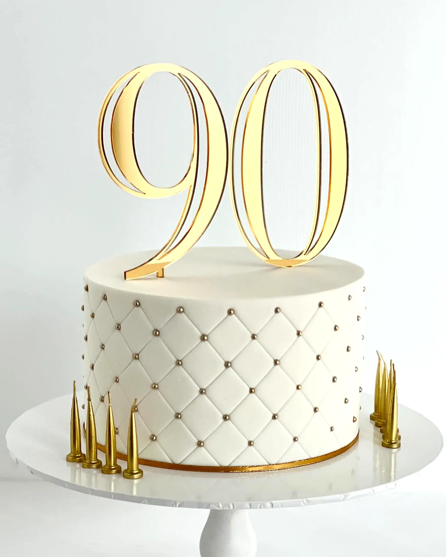 Elegant 90th Birthday Cake Delightful Fondant Design in White and Gold