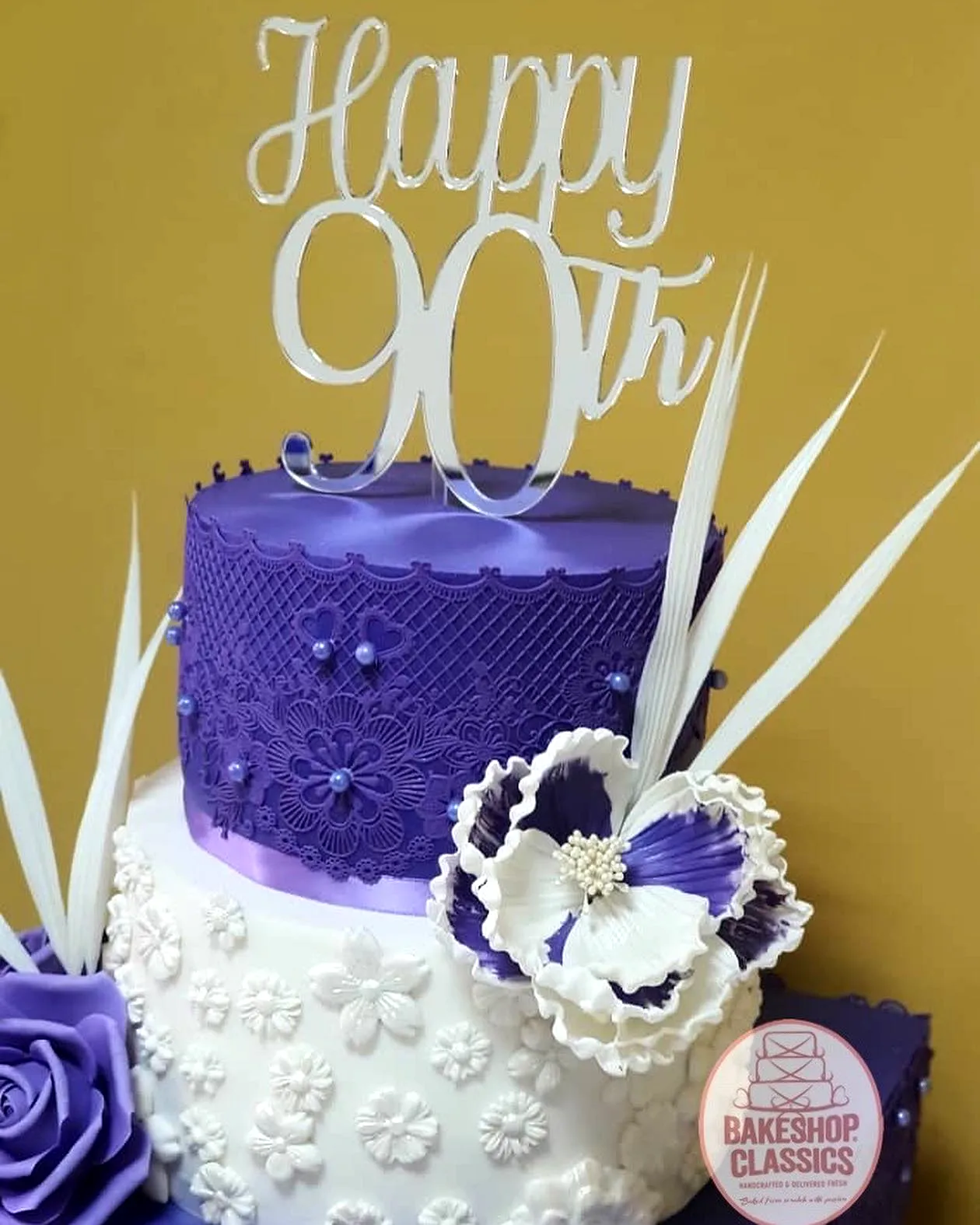 Elegant 90th Birthday Cake Design with Vibrant Colors and Delicate Details