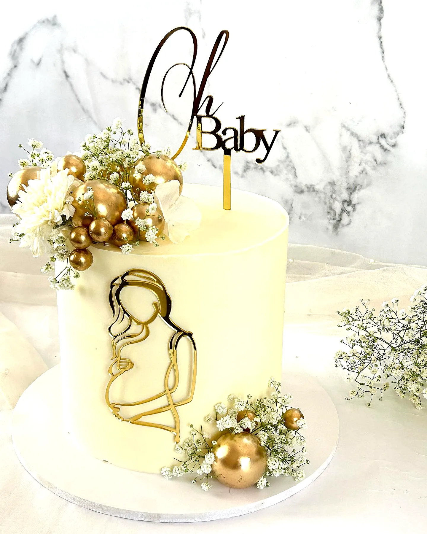 Elegant Baby Shower Cake with Modern Design and Floral Accents