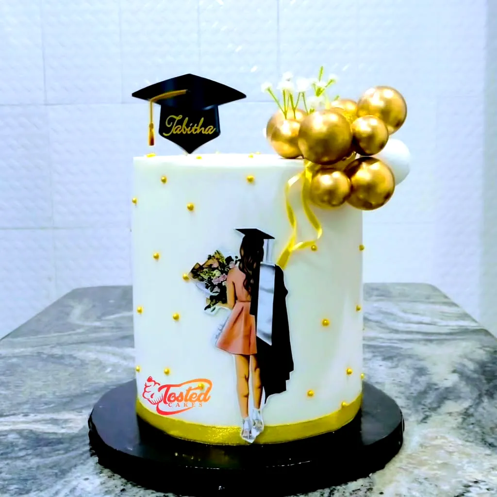 Elegant Black and Gold Graduation Cake Design for Celebrating Achievements