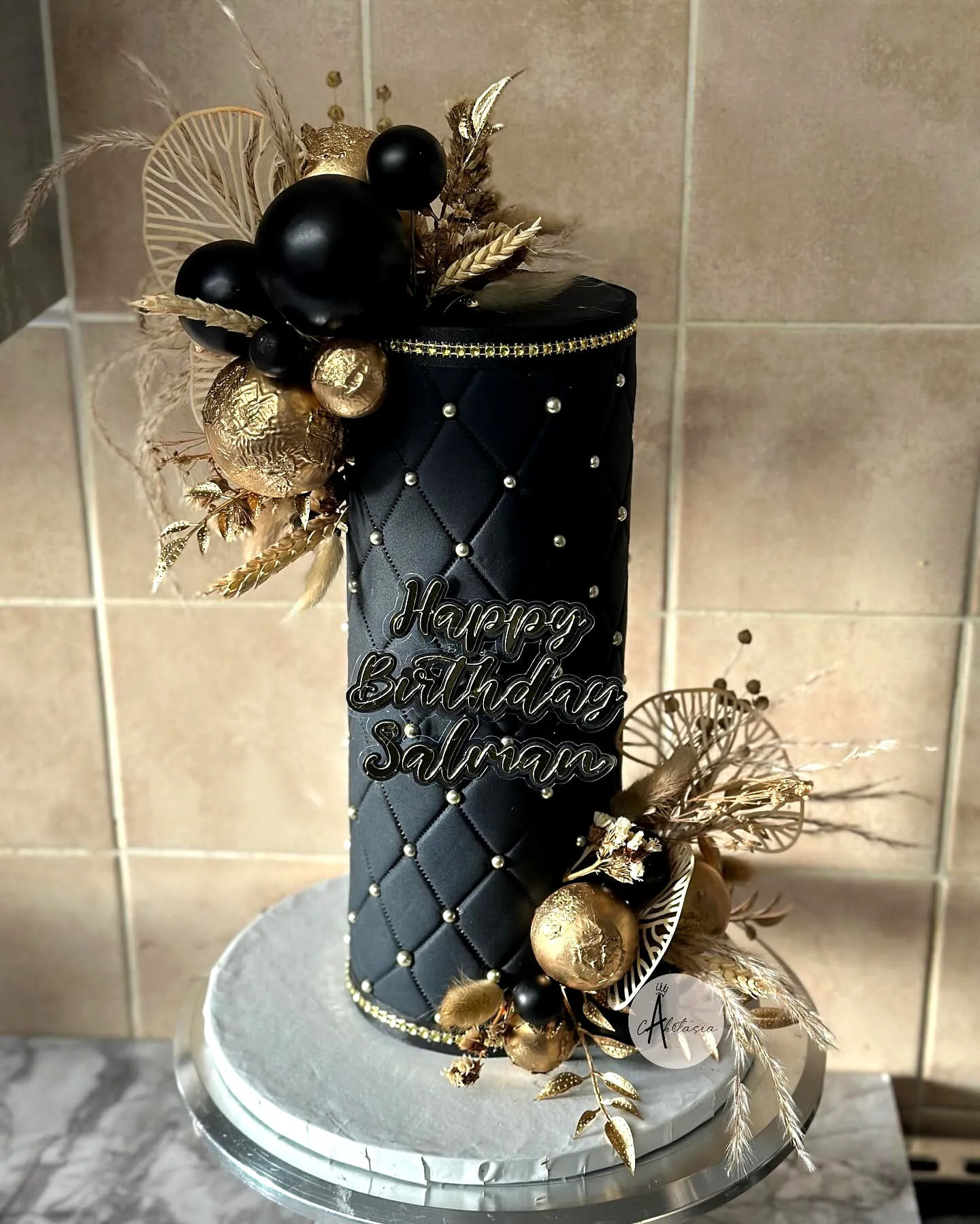 Elegant Black Birthday Cake for Men with Gold Accents and Festive Touches
