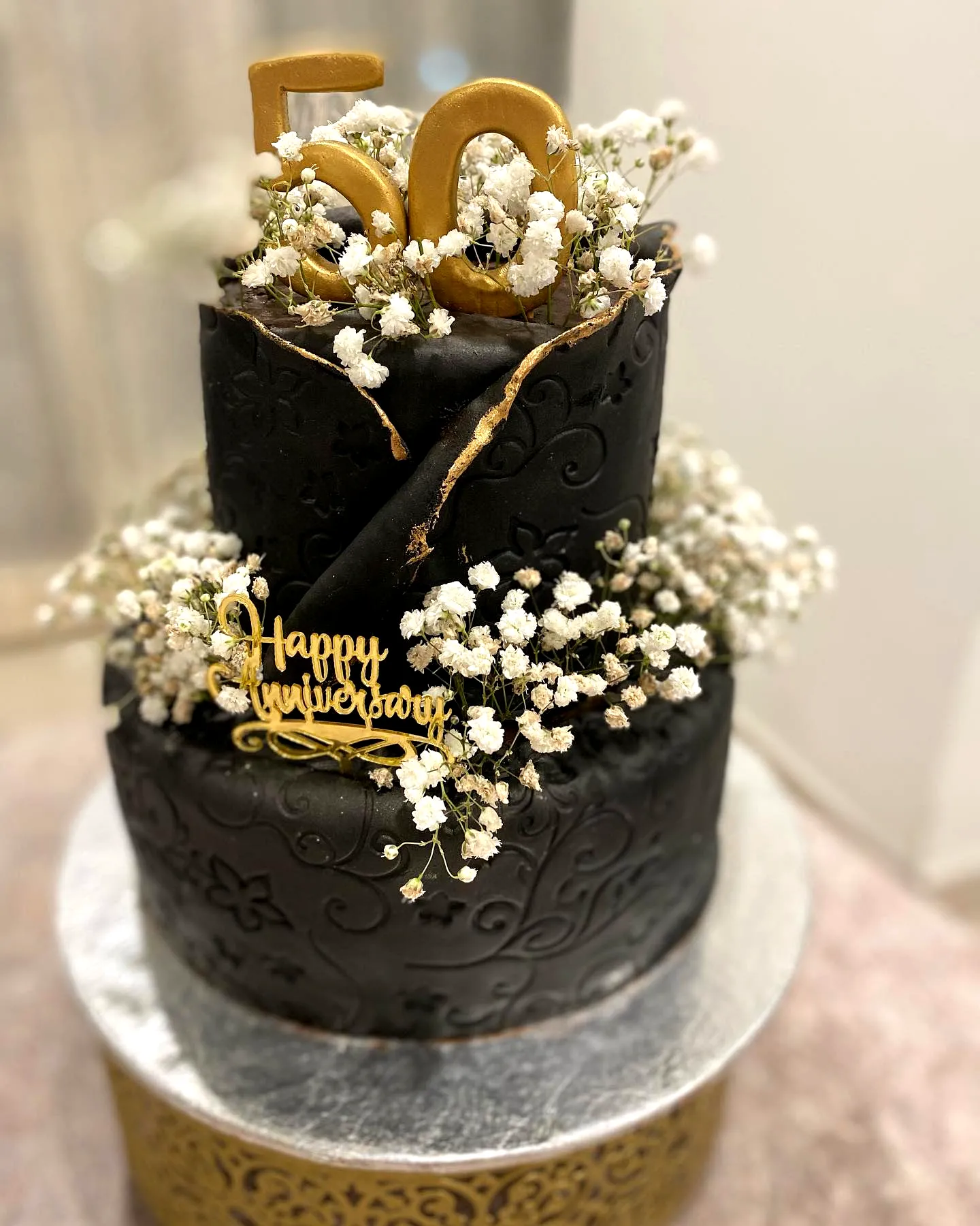 Elegant Black Fondant Cake for 50th Wedding Anniversary Celebration