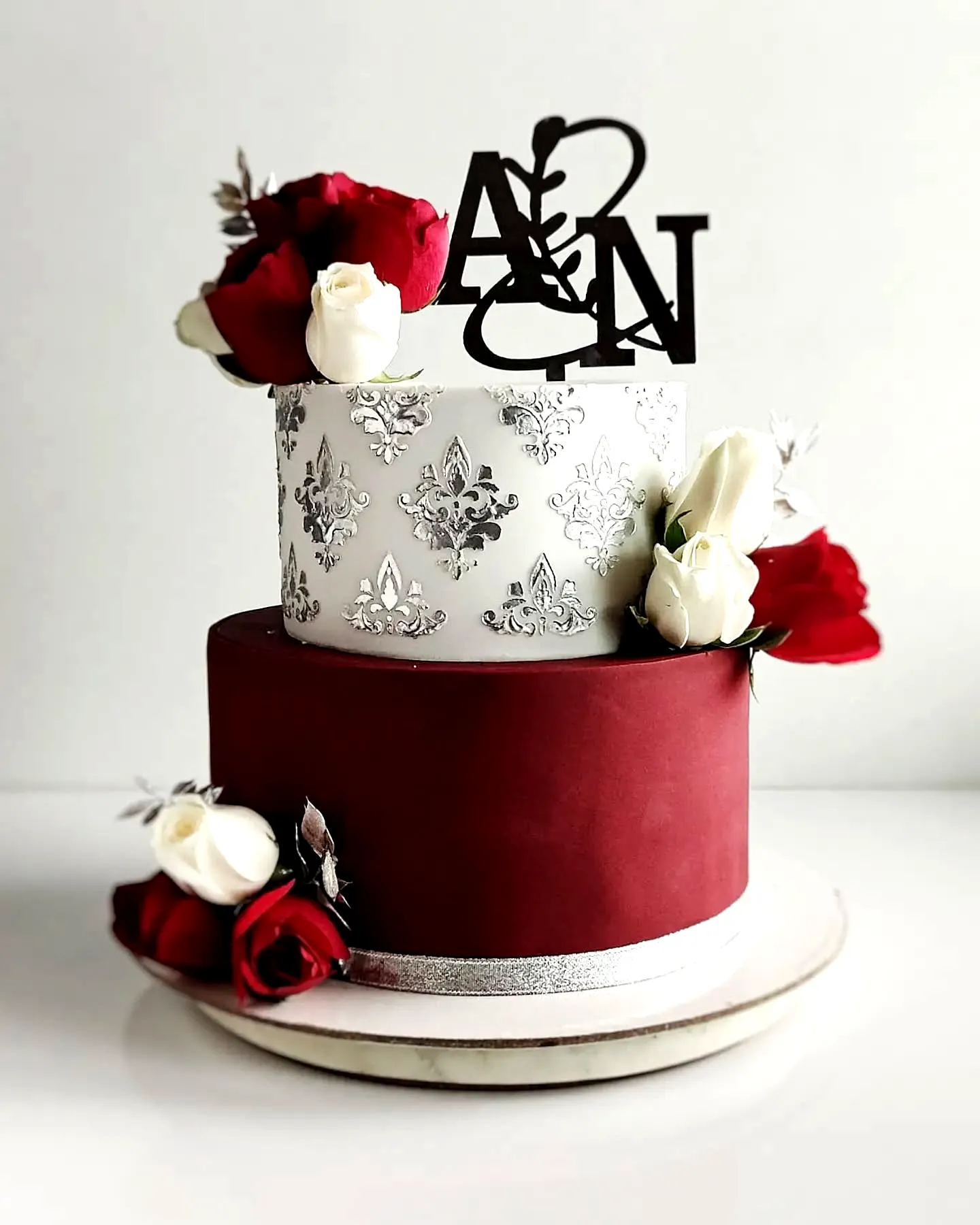 Elegant burgundy wedding cake design perfect for a sophisticated celebration
