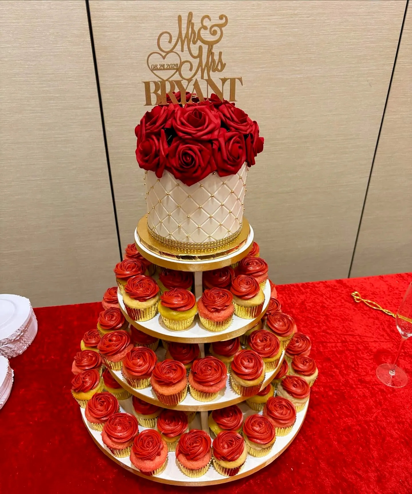 Elegant Cupcake Wedding Cake Design with Red Roses and Gold Accents