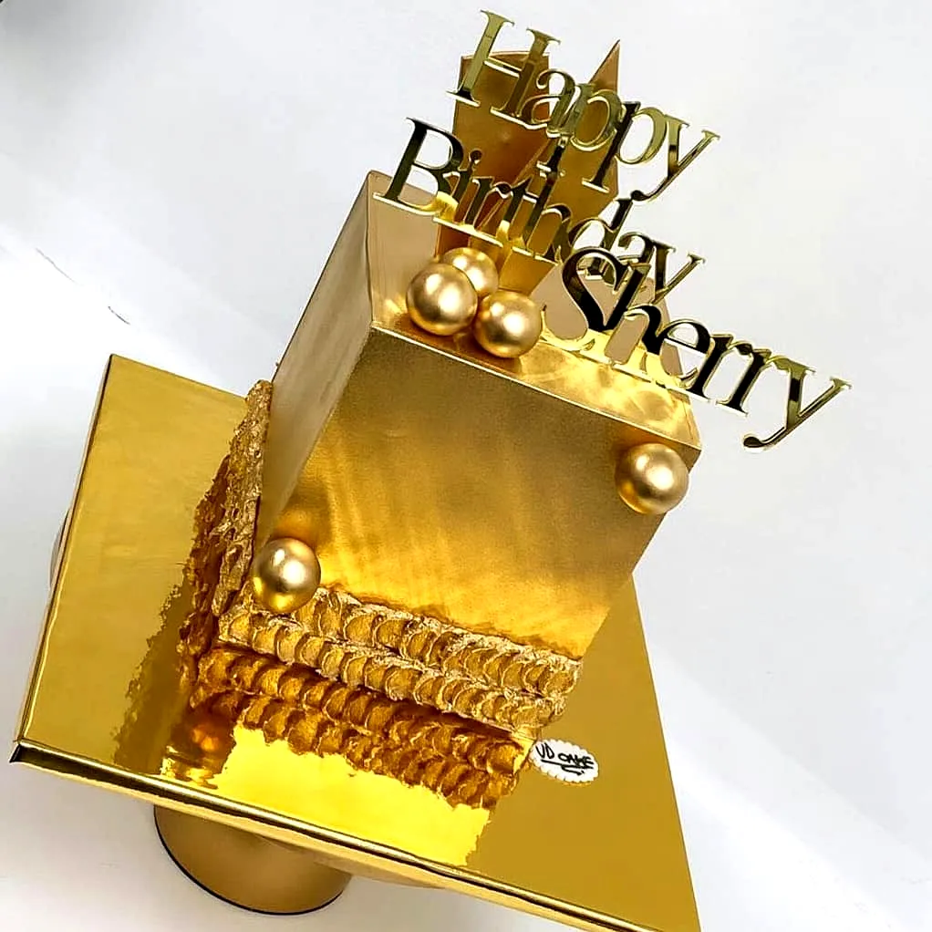 Elegant golden birthday cake design for your special celebration