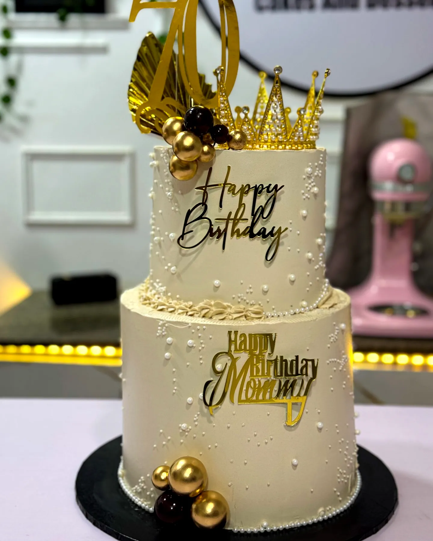 Elegant golden birthday cake design with luxurious accents and textures