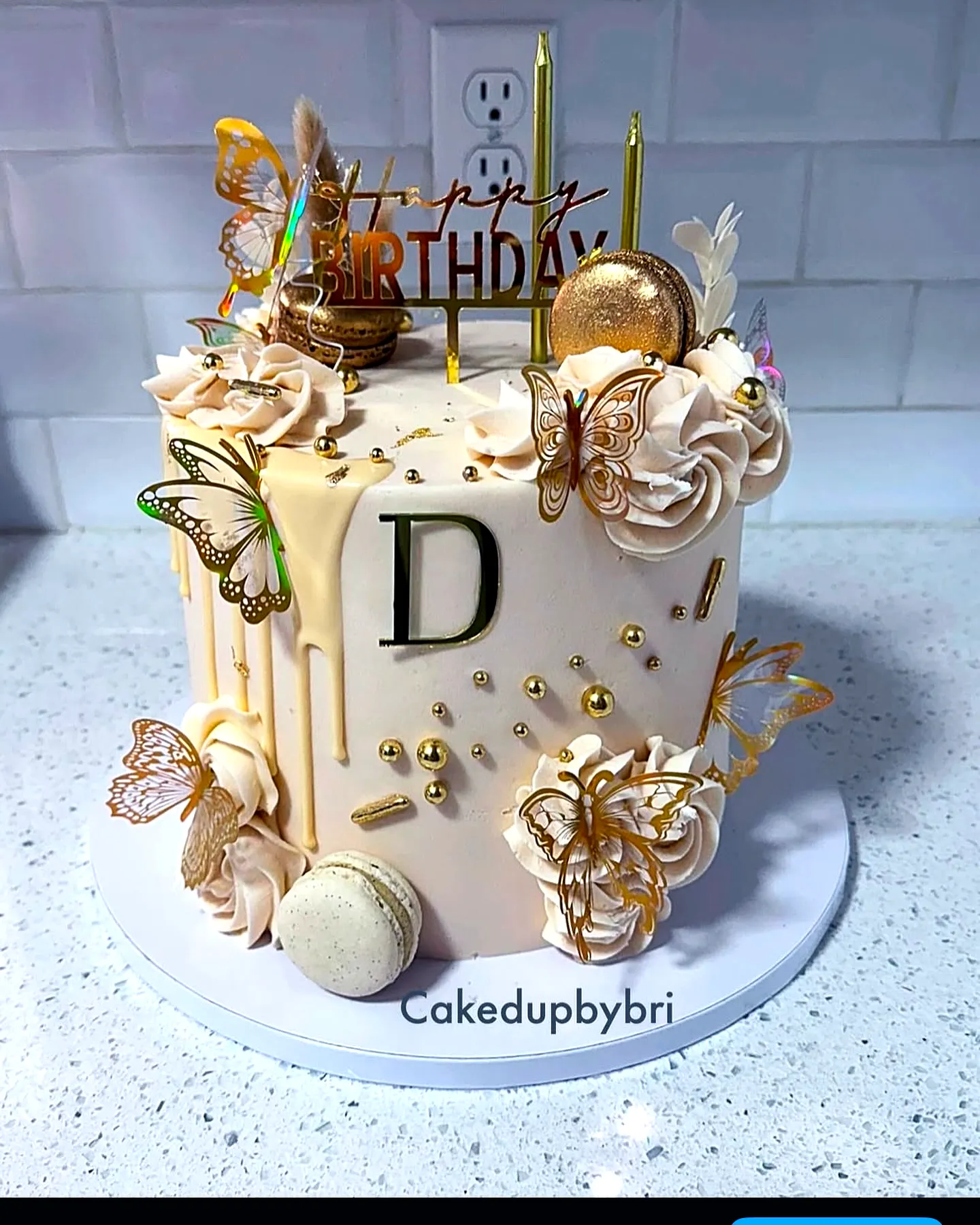 Elegant golden birthday cake inspiration with pink buttercream and gold accents