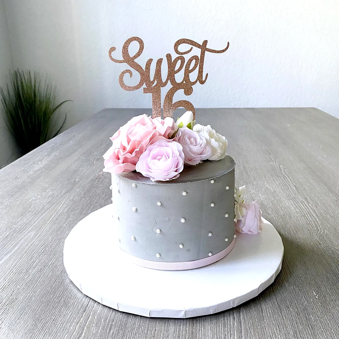 Elegant gray and pastel floral 16th birthday cake design