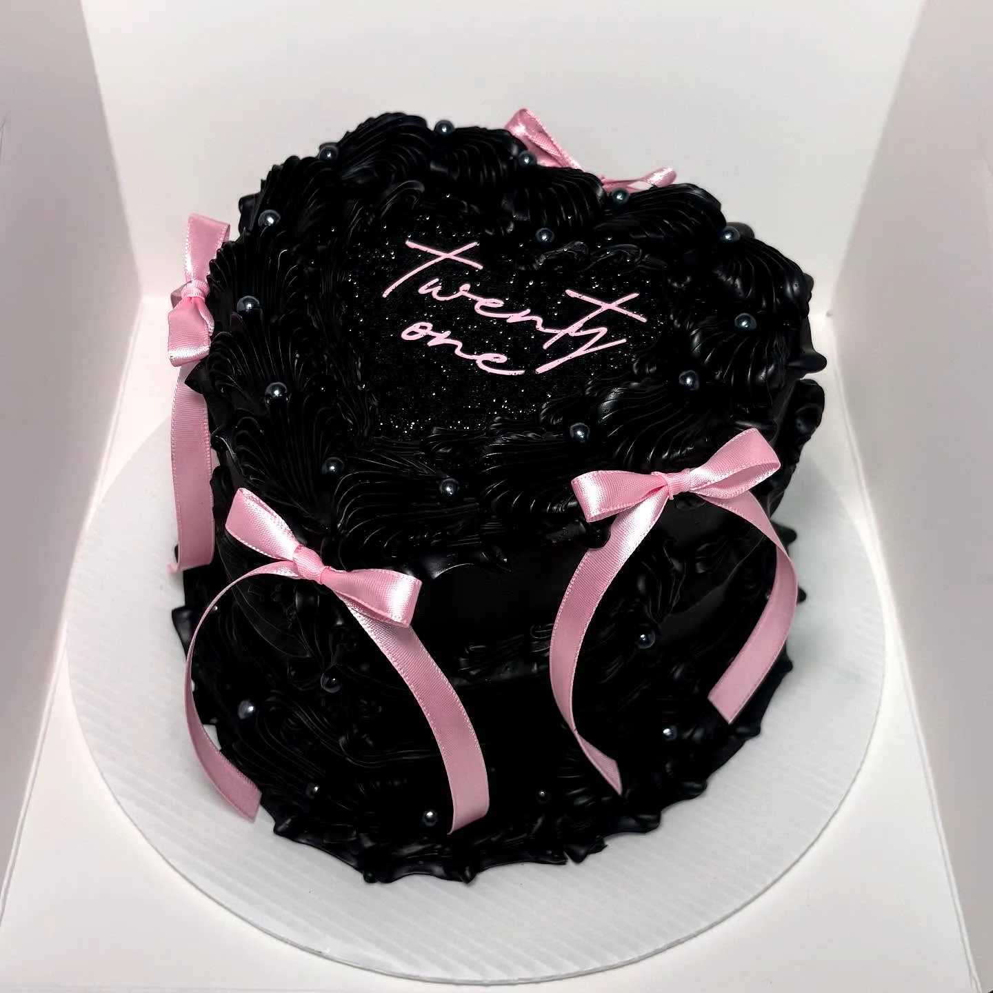 Elegant Heart-Shaped 21st Birthday Cake with Black Buttercream and Pink Accents