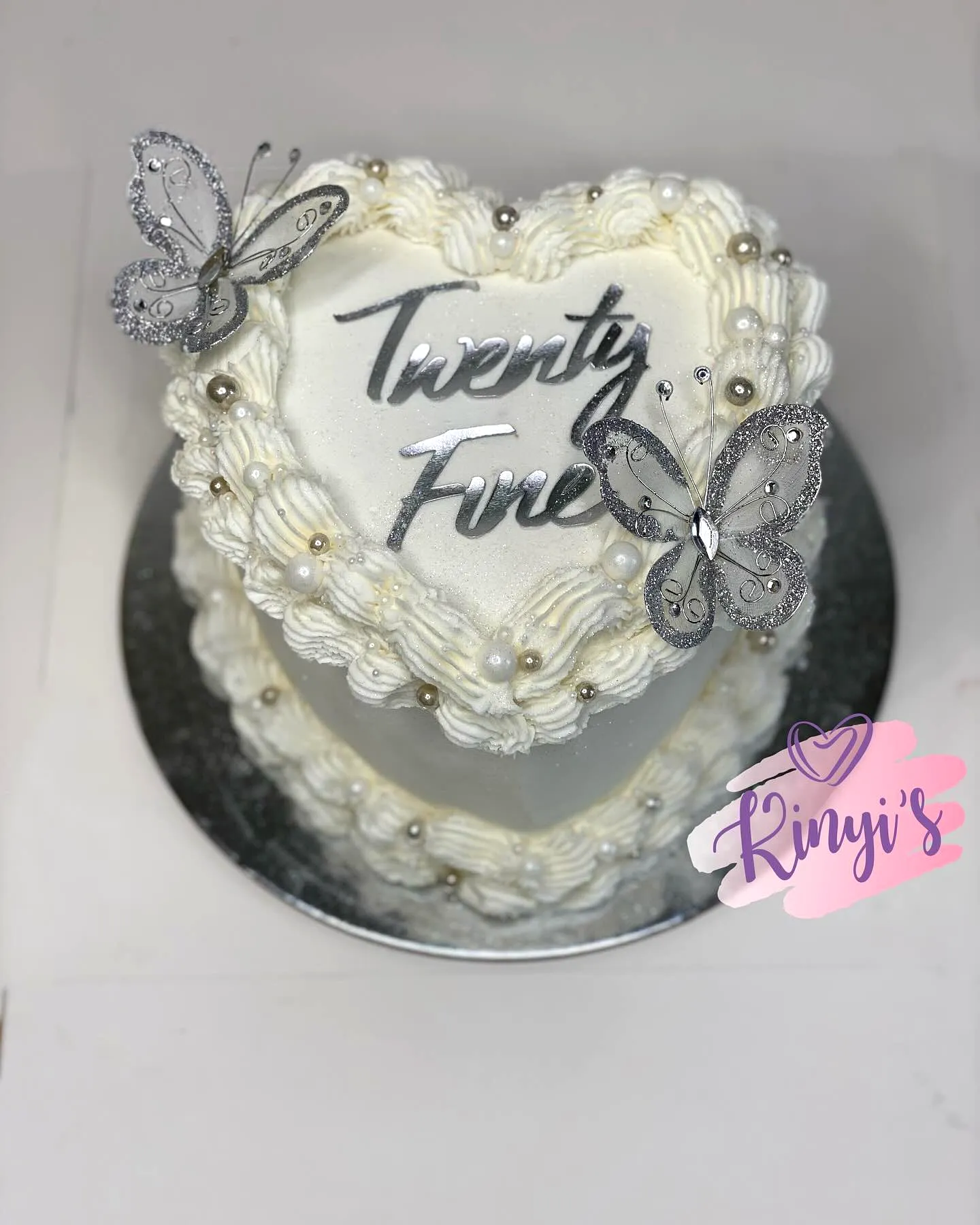 Elegant heart-shaped birthday cake for a memorable 25th birthday celebration