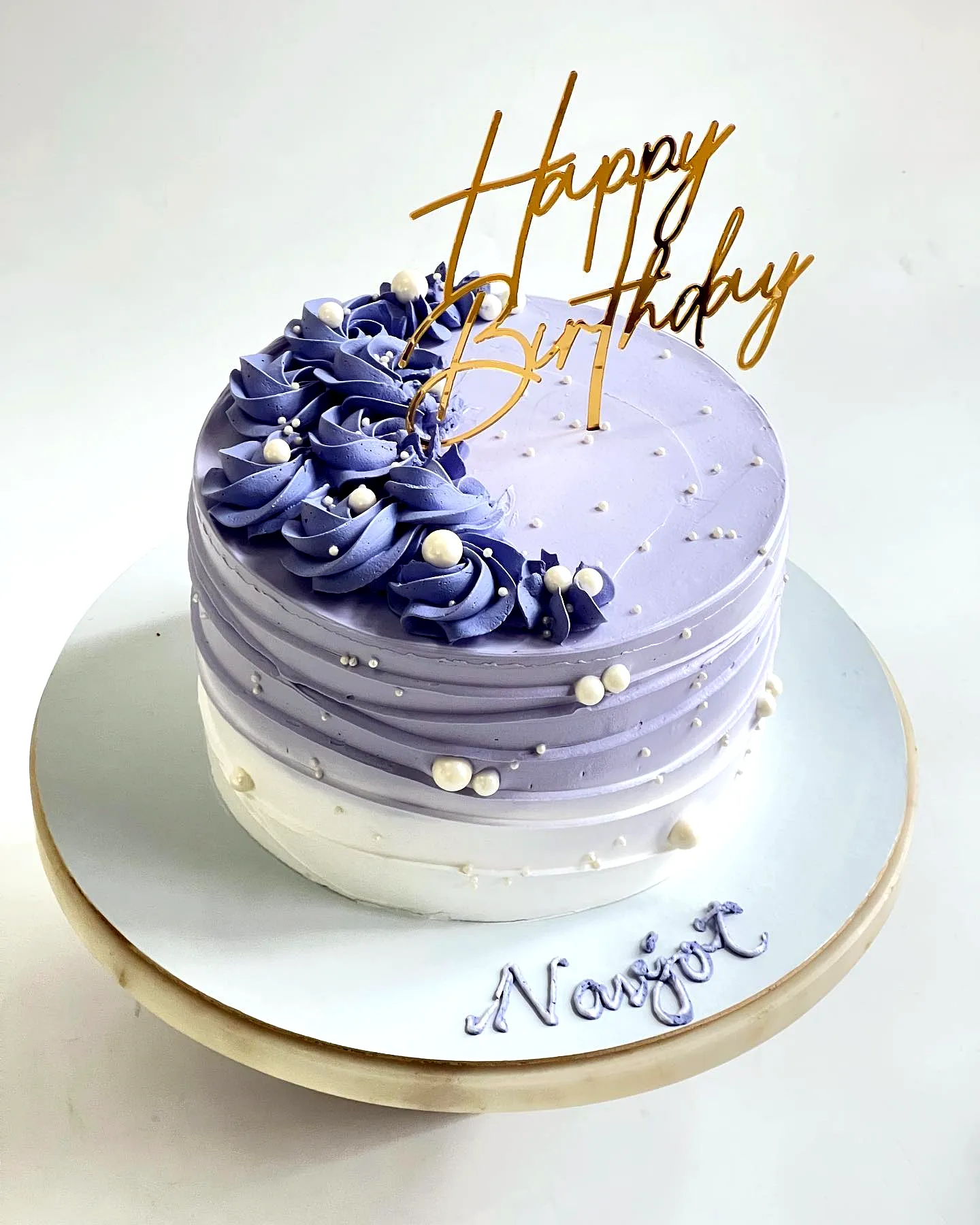 Elegant Lavender Birthday Cake Design with Delicate Rosettes and Pearls