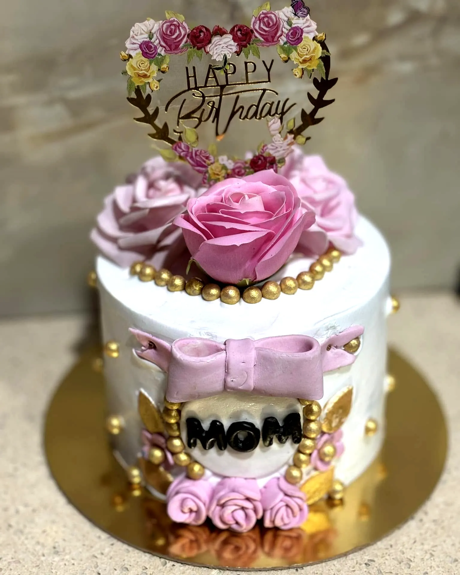 Elegant mother birthday cake design with pink roses and gold accents