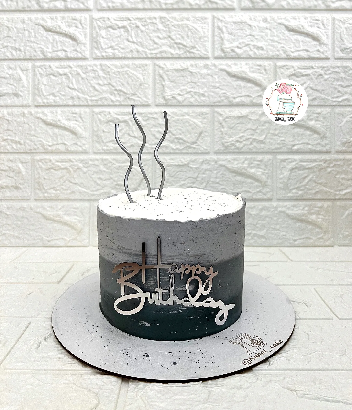 Elegant ombre birthday cake for men with textured frosting and modern decor