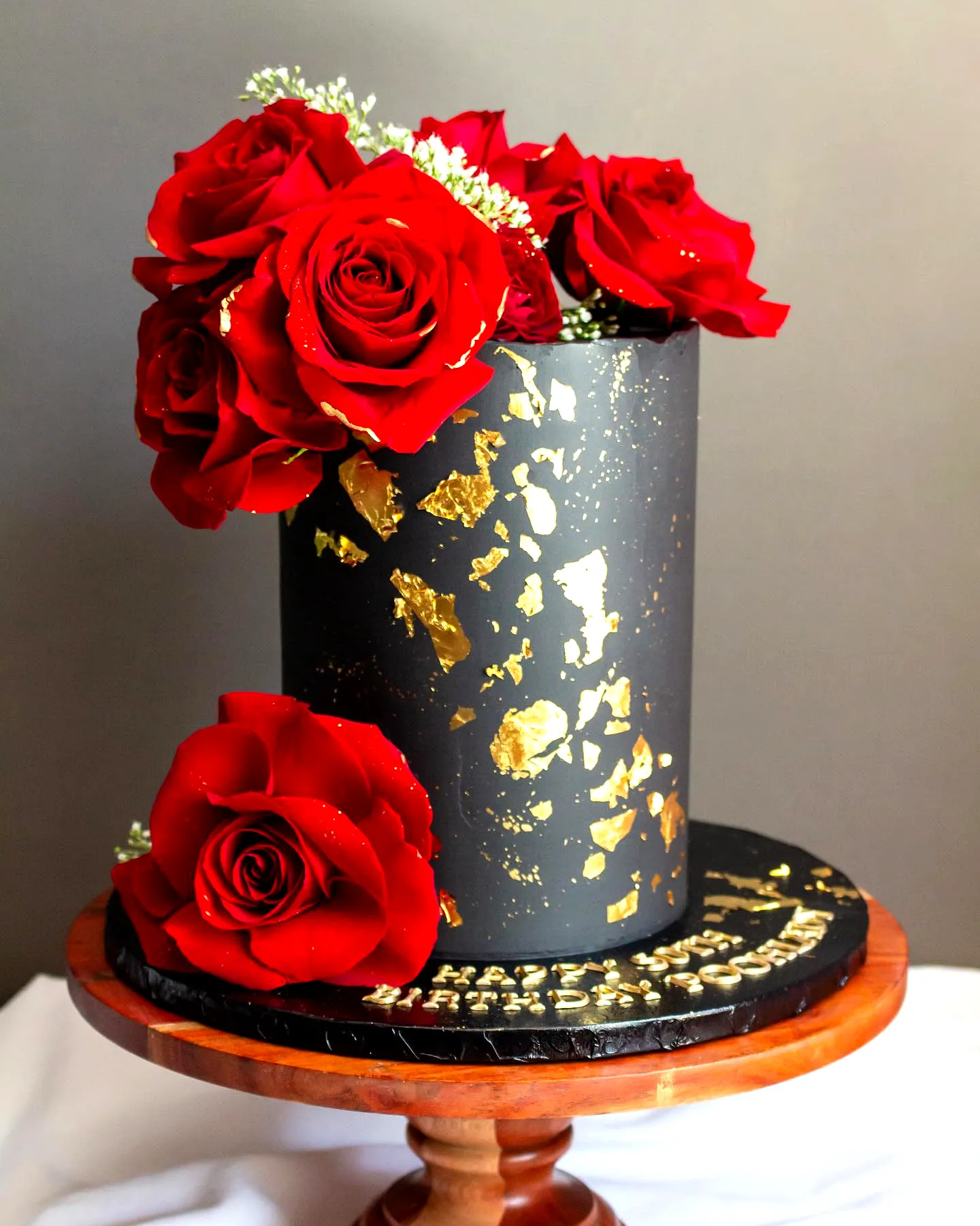 Elegant Red and Black Birthday Cake Design for Luxurious Celebrations