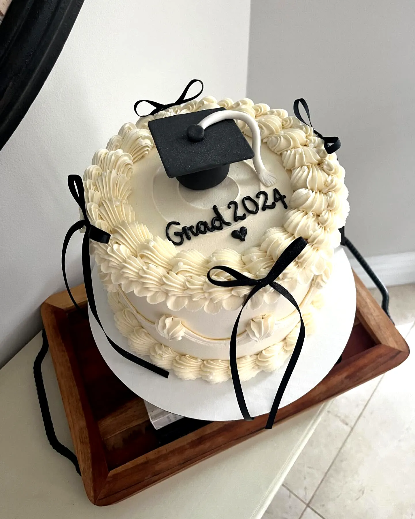 Elegant Simple Graduation Cake with Classic Buttercream Finish and Flowers