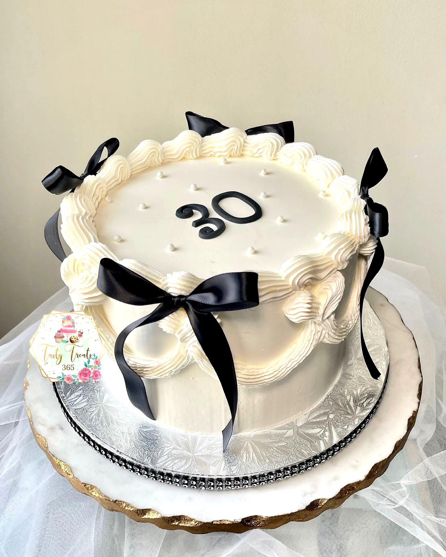 Elegant Two-Tiered Birthday Cake for a Stylish 30th Birthday Celebration