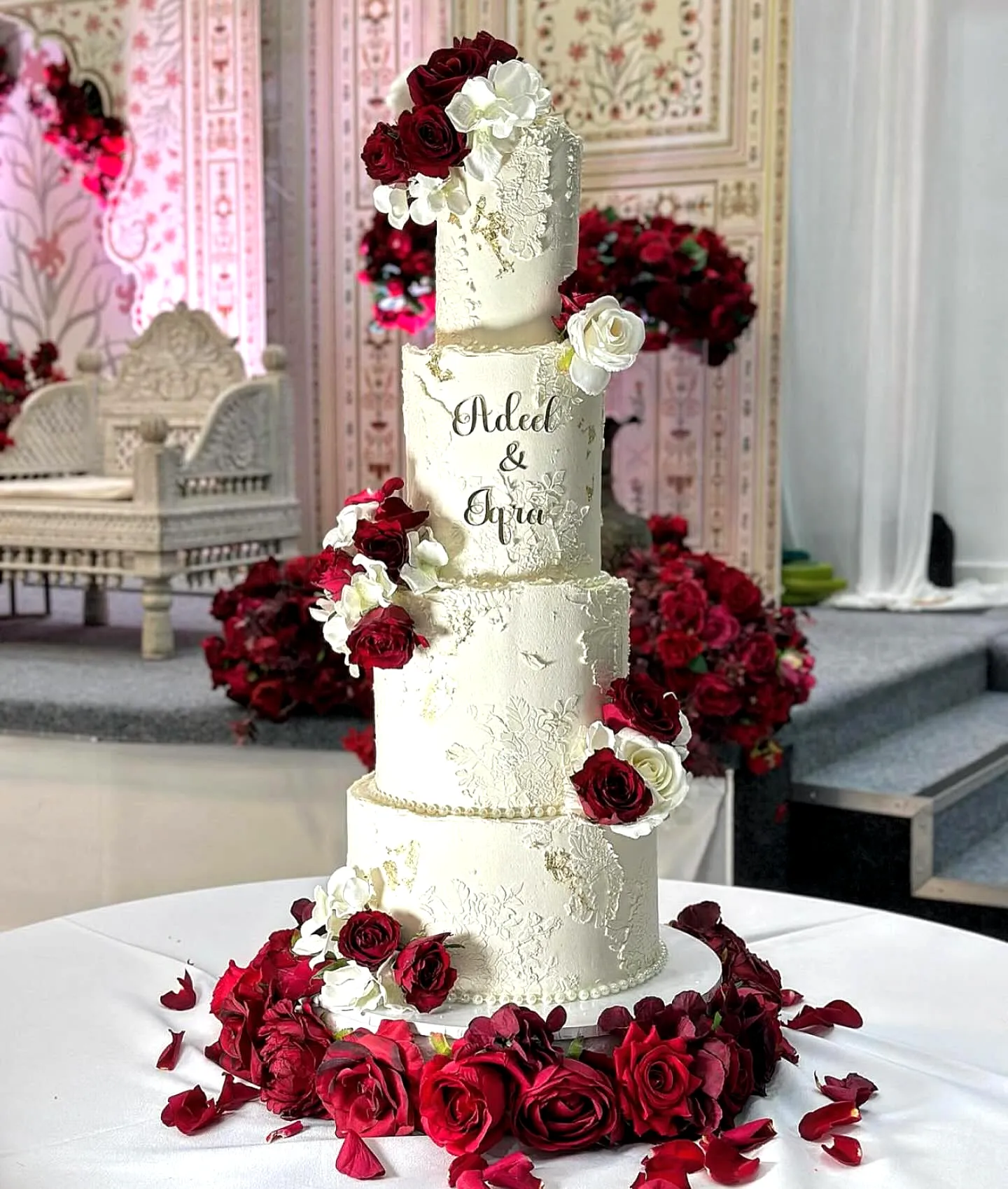 Elegant wedding cake design in classic white with romantic floral accents