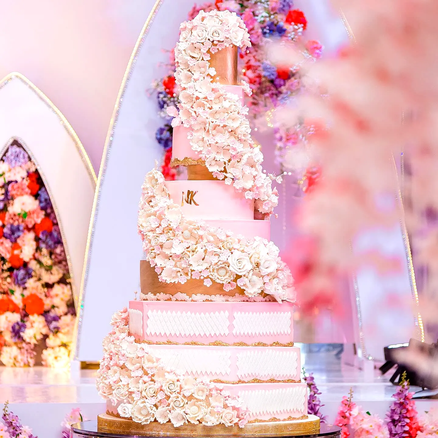 Elegant Wedding Cake Design with Gold and Soft Pink Floral Details