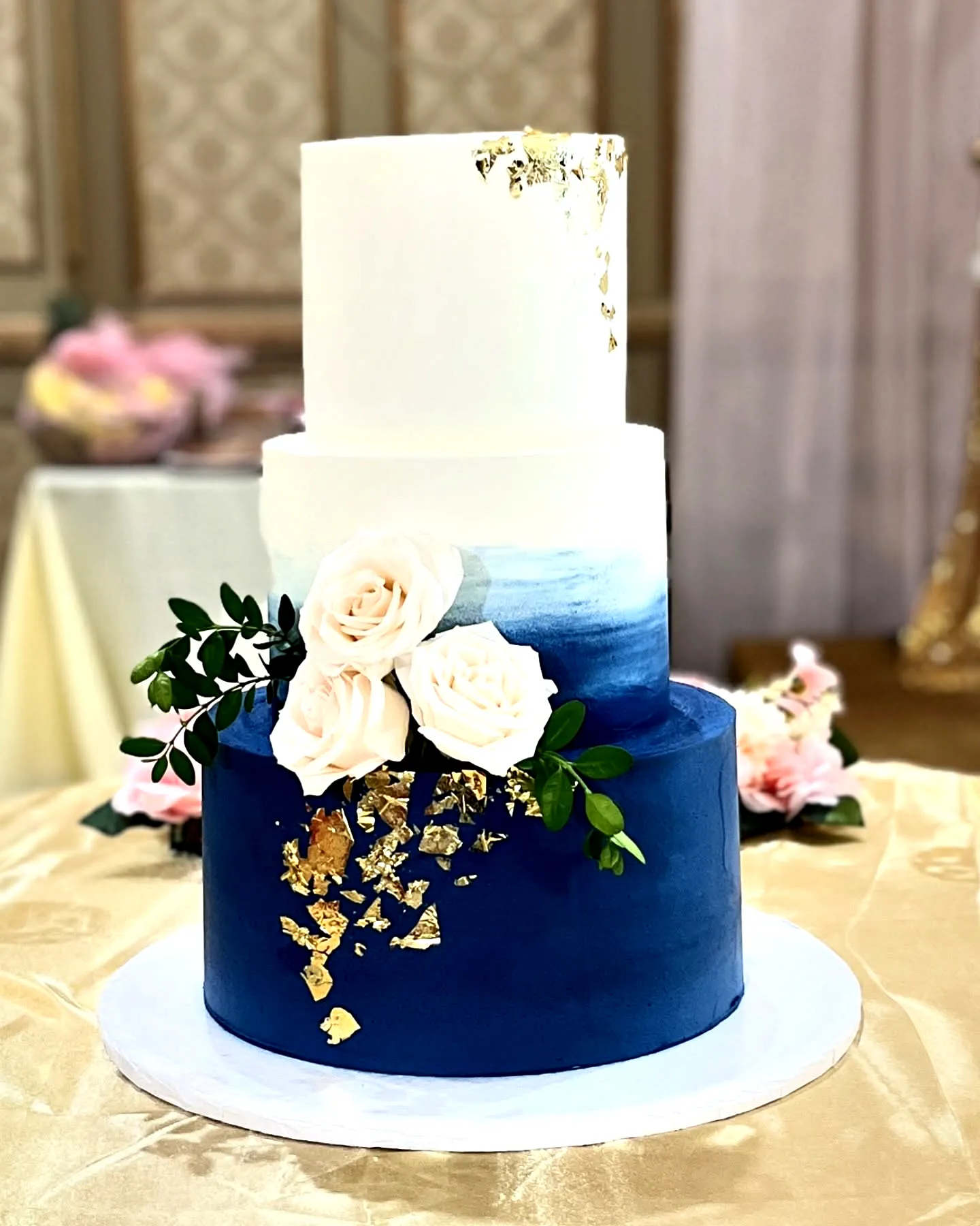 Elegant wedding cake design with modern ombre and floral accents
