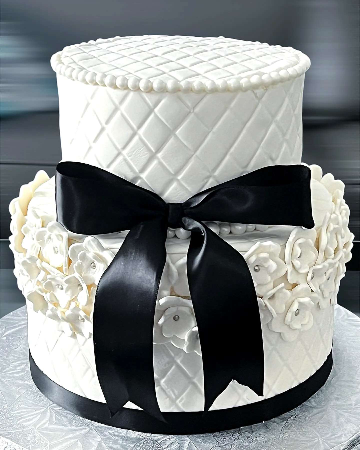 Elegant Wedding Cake Design with Quilted Texture and Sugar Flowers