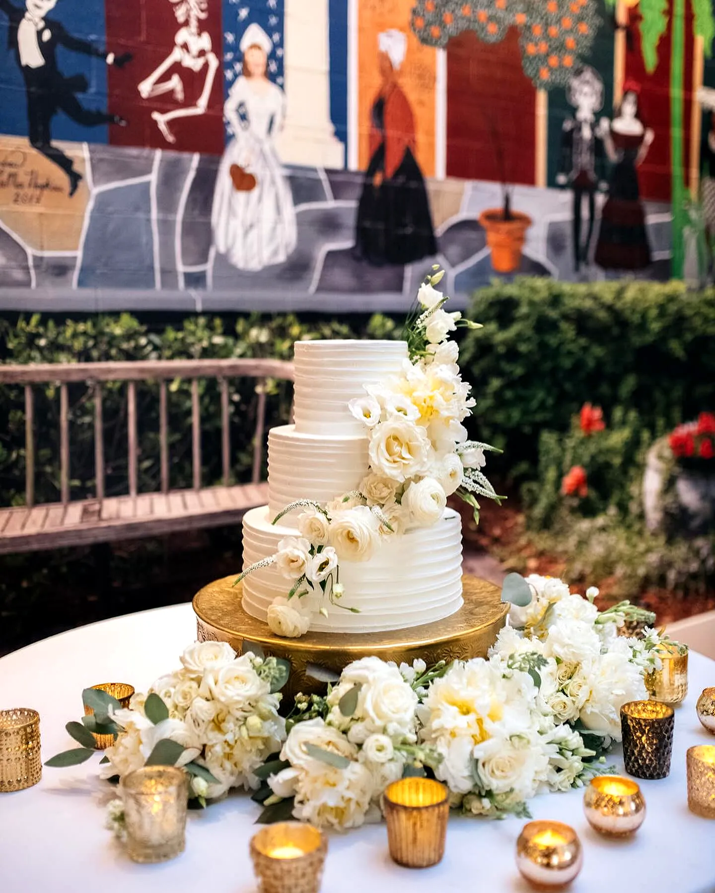 Elegant Wedding Cake Table with Classic White Cake and Floral Accents