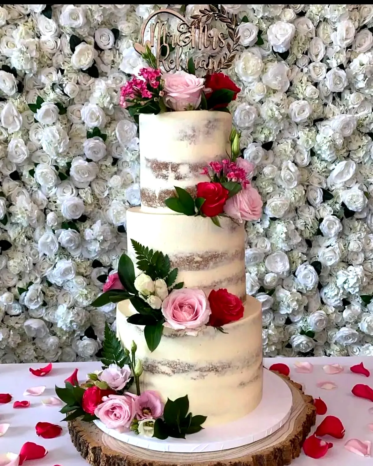 Elegant wedding cake with rustic charm and fresh floral accents