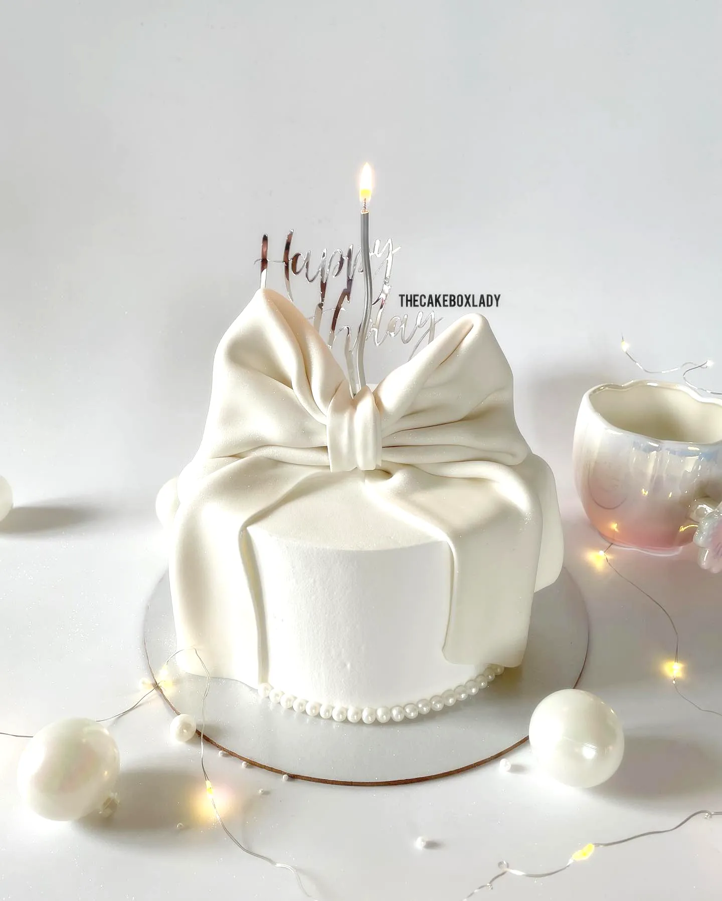 Elegant White Birthday Cake Design for a Stylish Celebration