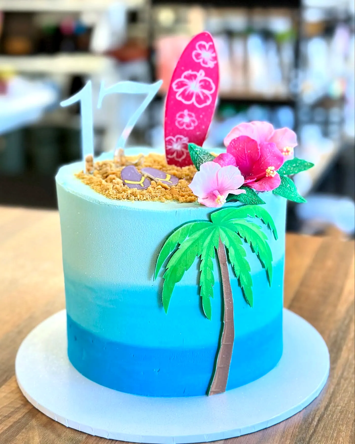 Fun Beach-Themed 17th Birthday Cake with Vibrant Ombre and Tropical Decor