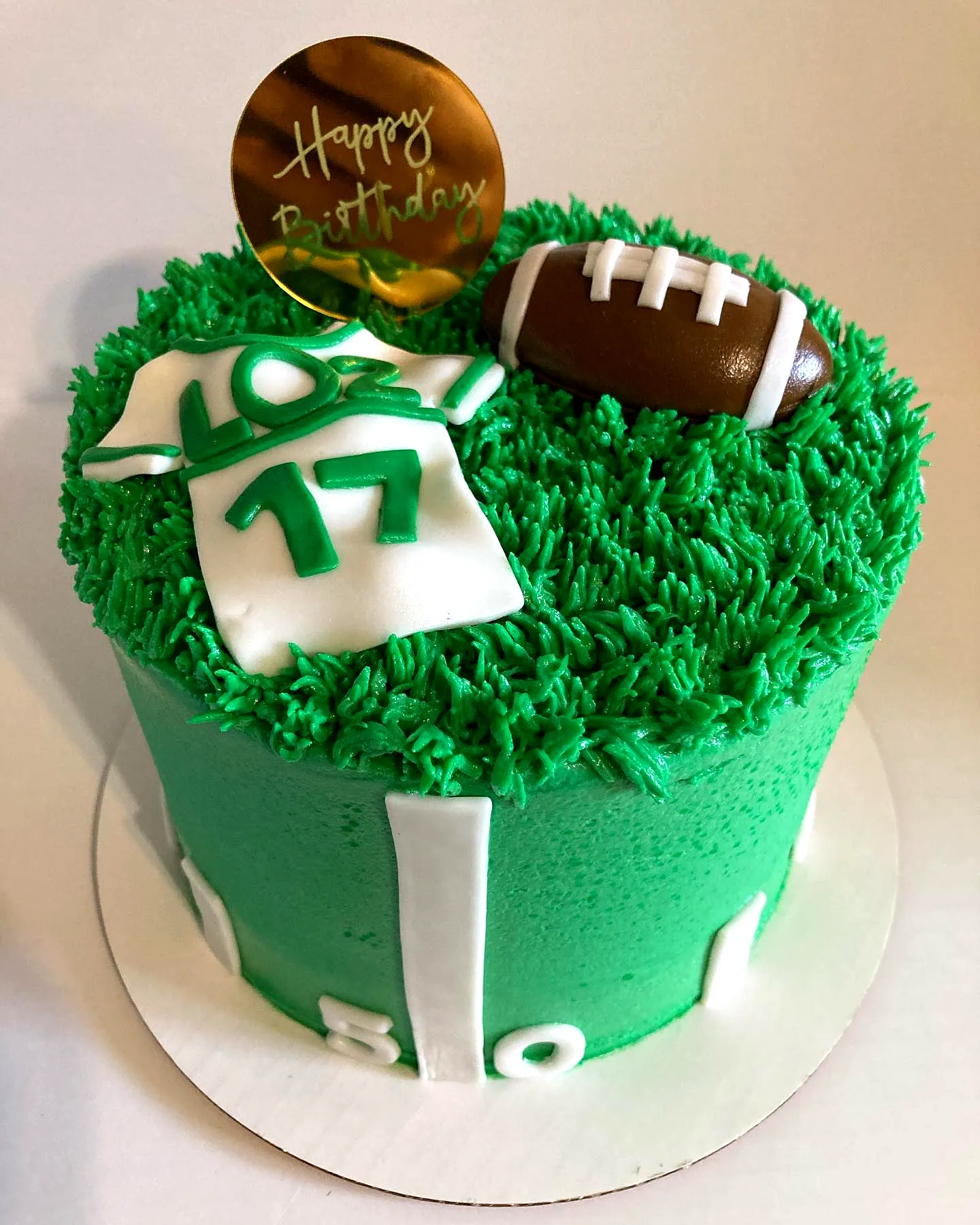 Fun football-themed 17th birthday cake design with vibrant green frosting