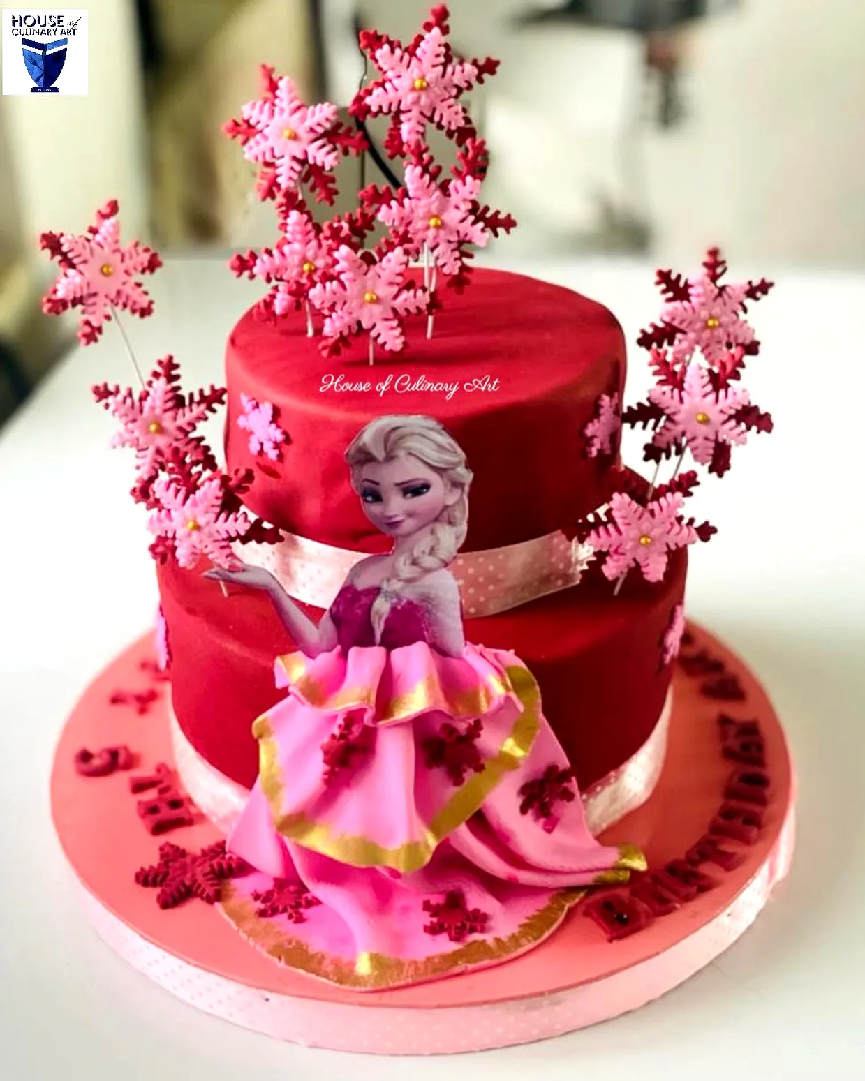 Fun Frozen Birthday Cake Design with Princess and Snowflake Decorations