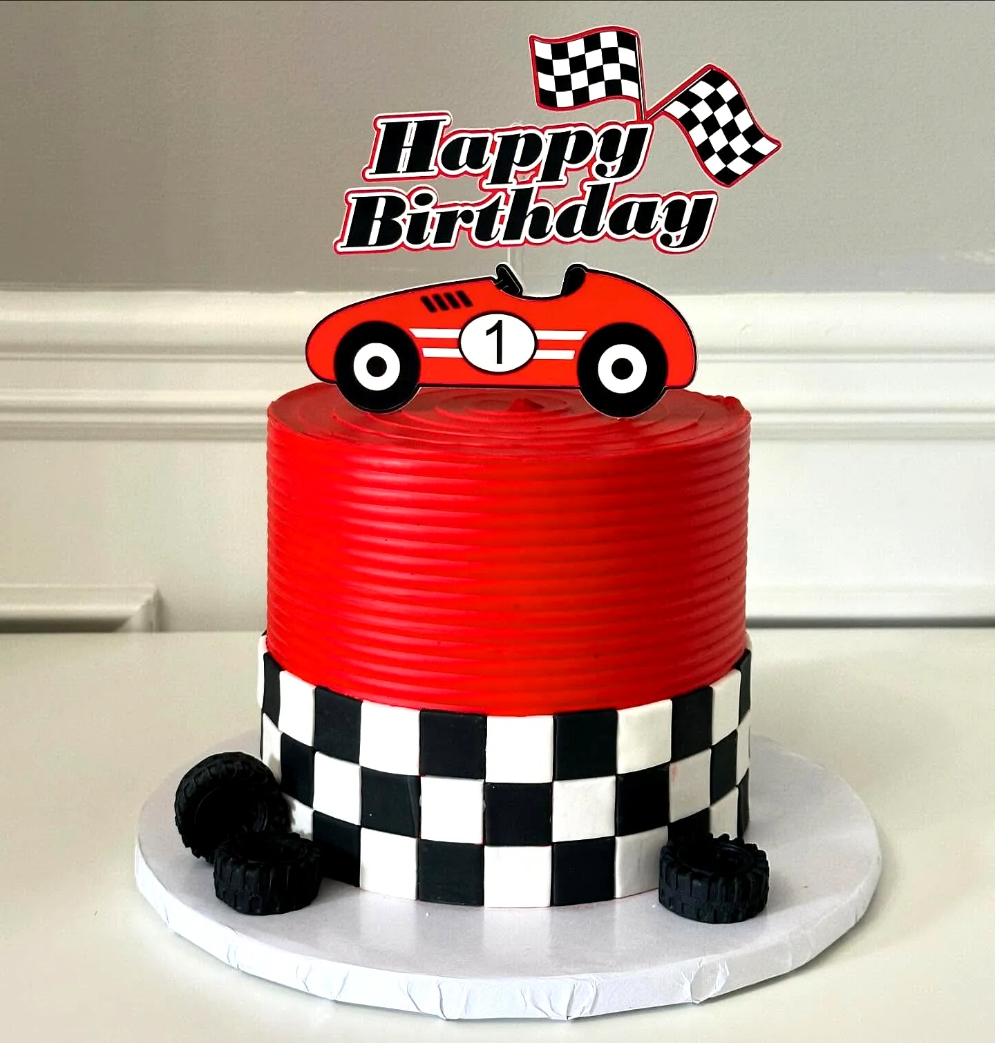 Fun Racing Theme Birthday Cake Design in Bold Red and Black Colors