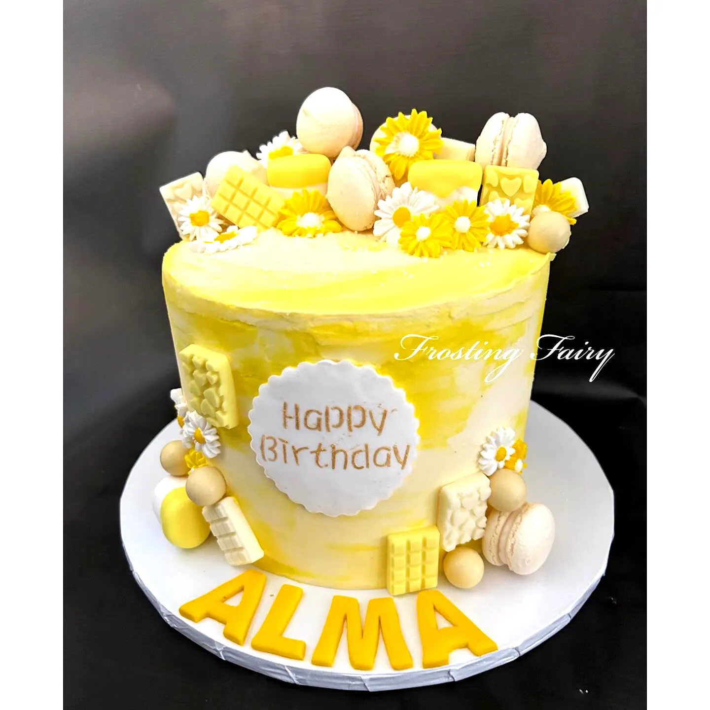 Fun Yellow Birthday Cake Design with Playful Decorations and Smooth Frosting