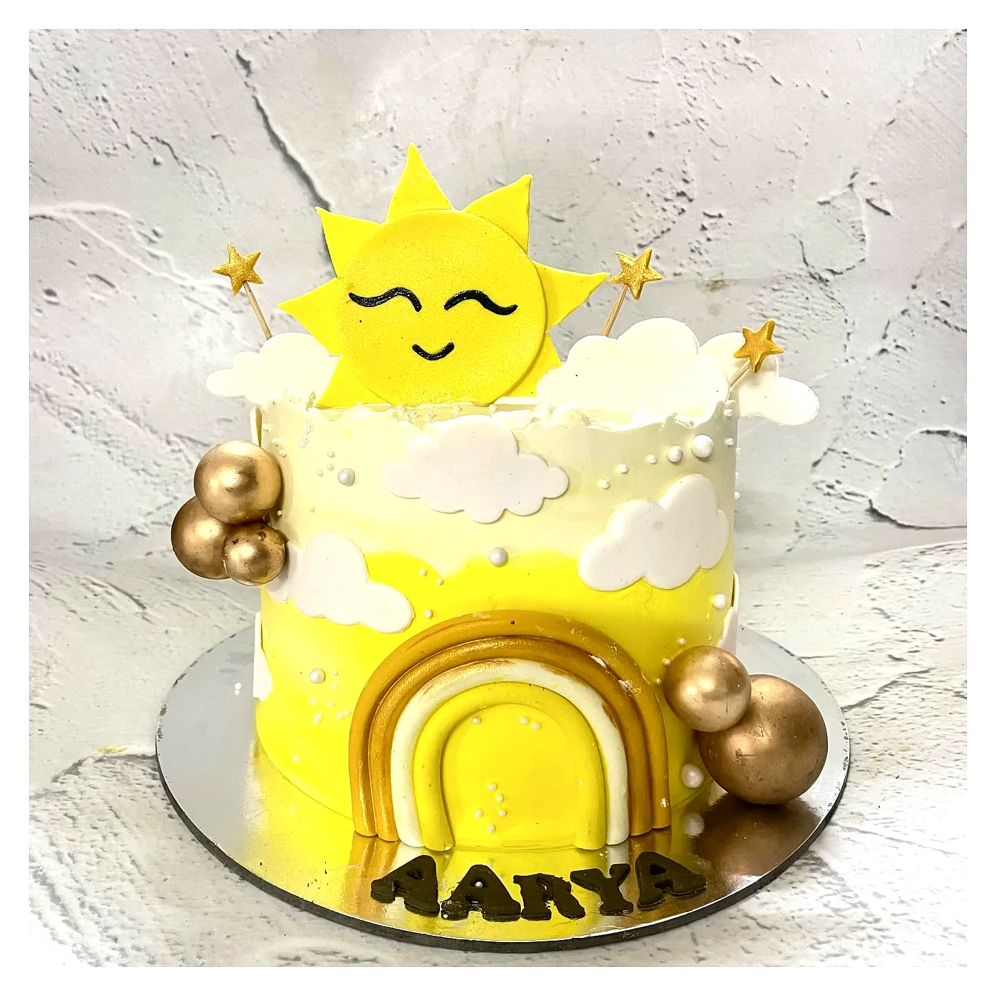 Fun Yellow Birthday Cake Design with Whimsical Decorations and Happy Sun Topper