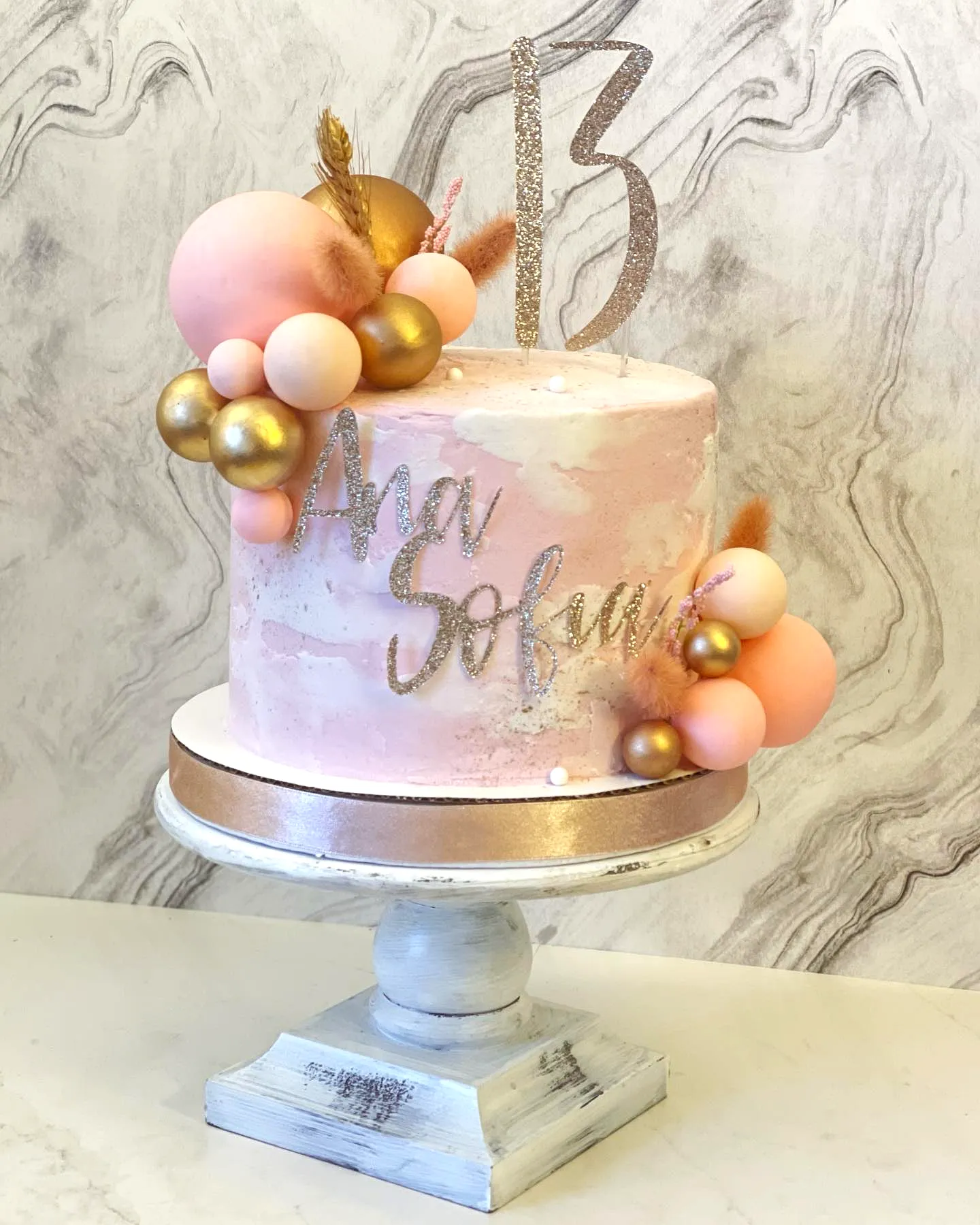 Lovely 13th Birthday Cake in Marbled Pink and Gold with Floral Accents