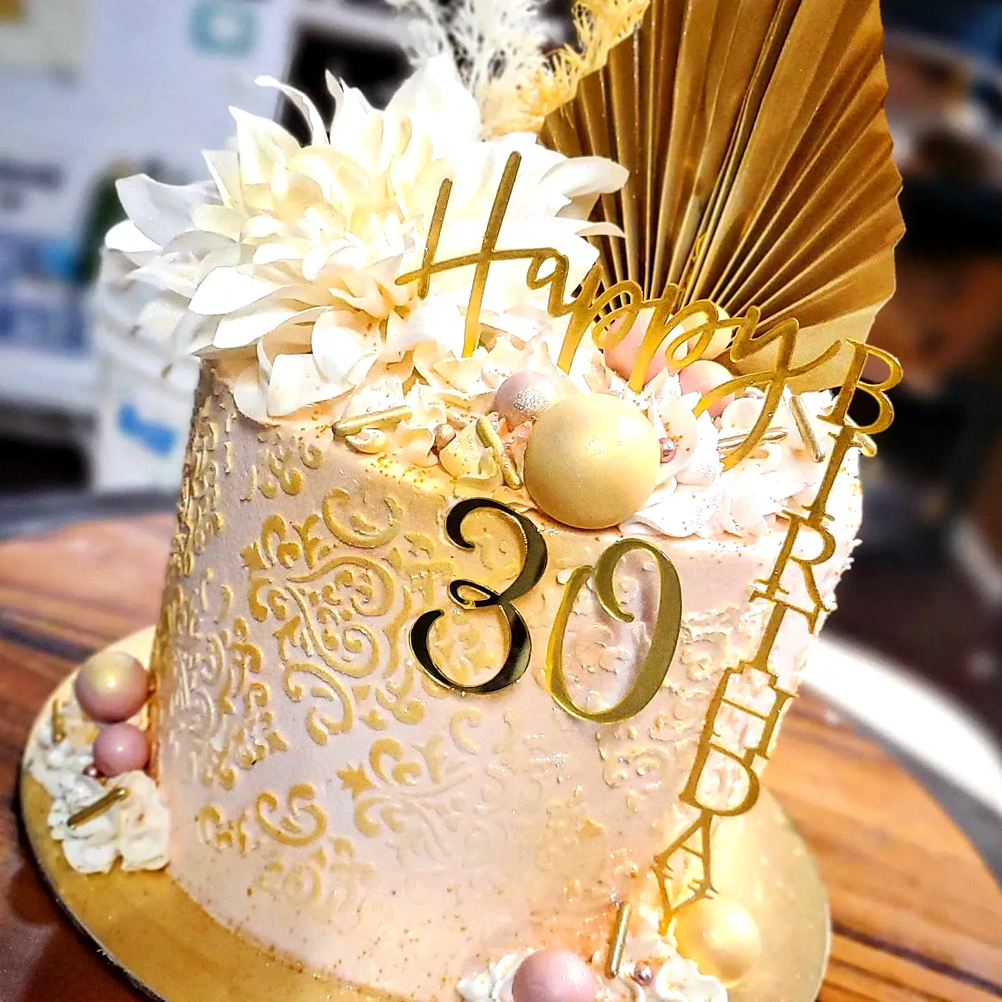 Lovely 30th birthday cake design in pastel pink with elegant gold accents