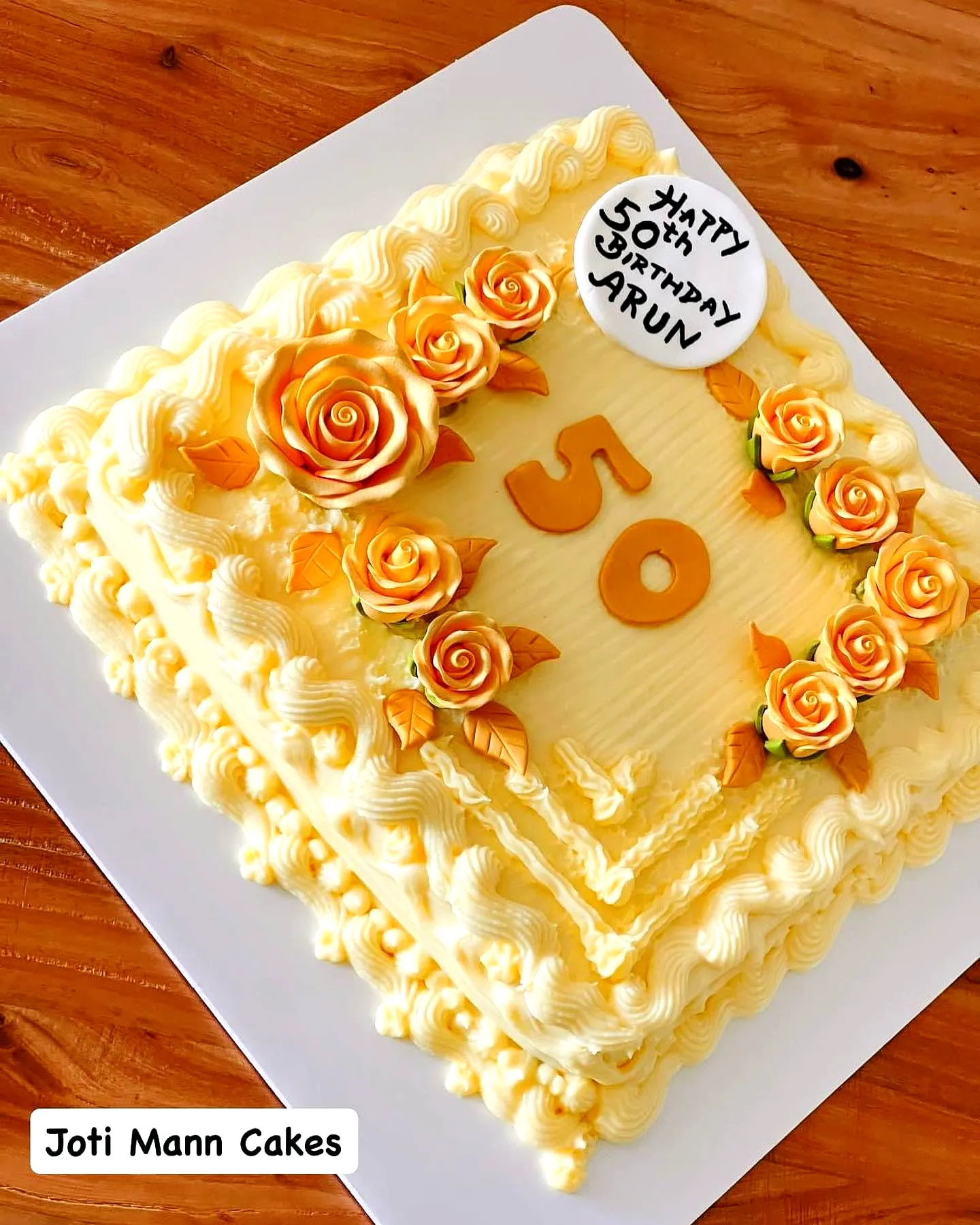 Lovely 50th Birthday Cake Design with Yellow Buttercream and Orange Roses