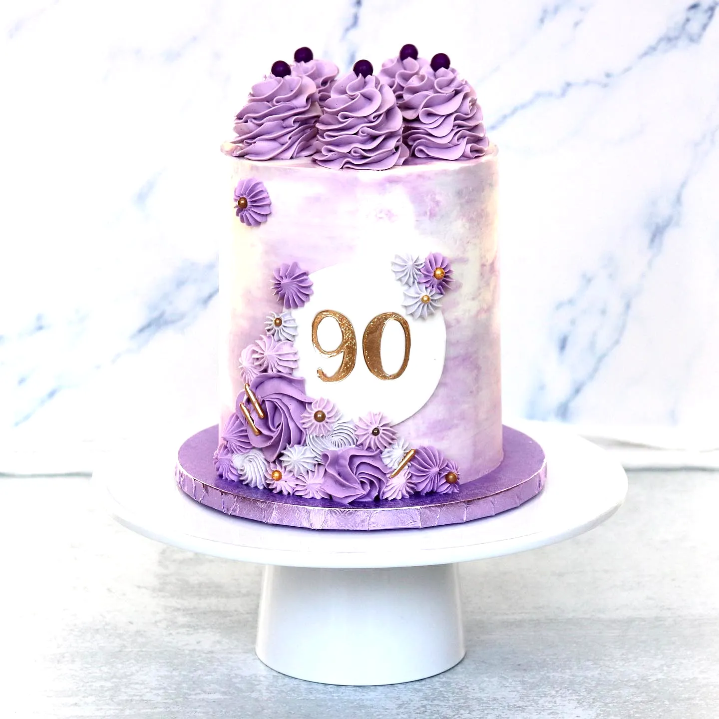 Lovely 90th birthday cake design in lavender and white buttercream
