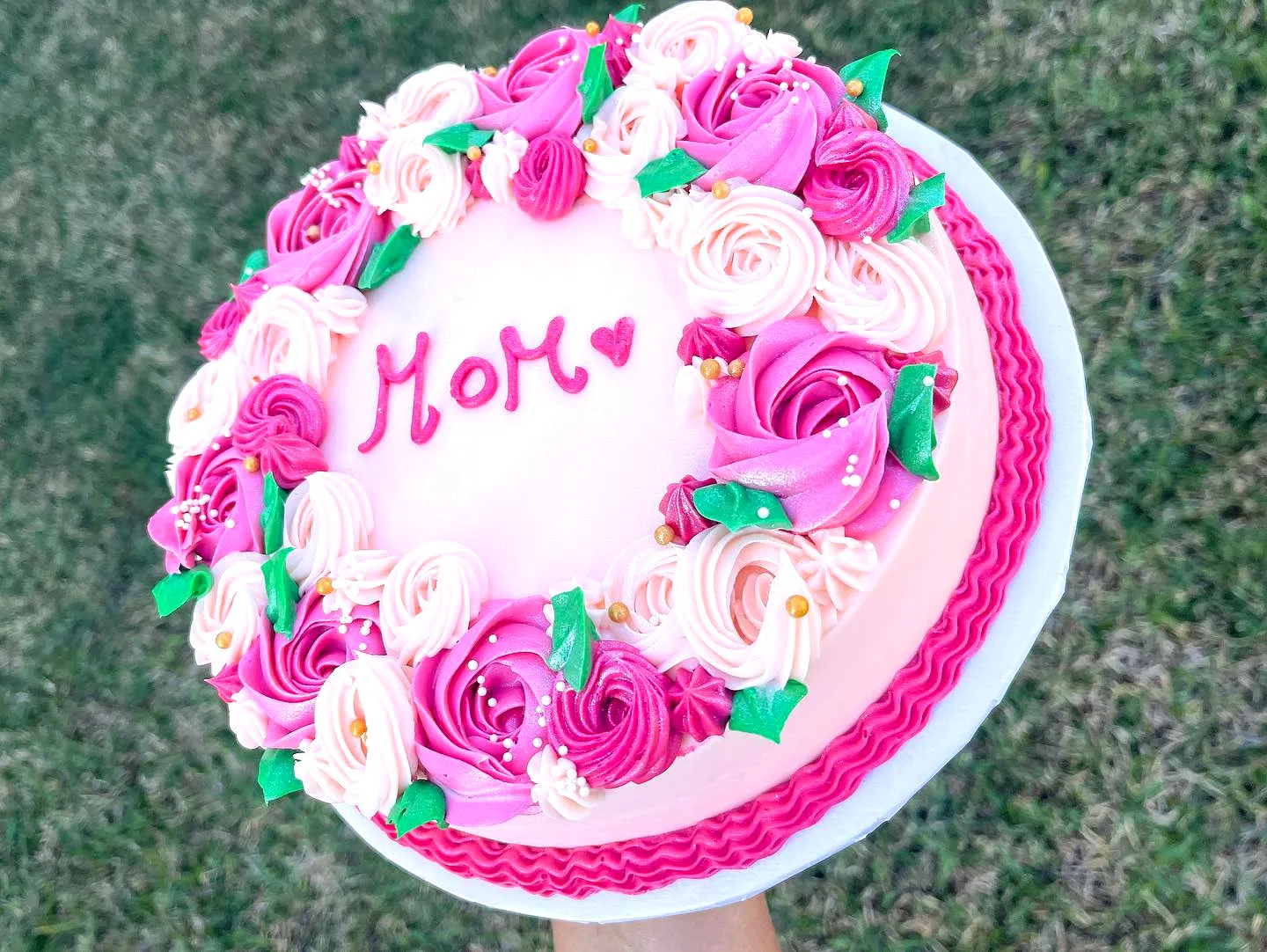Lovely buttercream mother birthday cake with roses and elegant accents