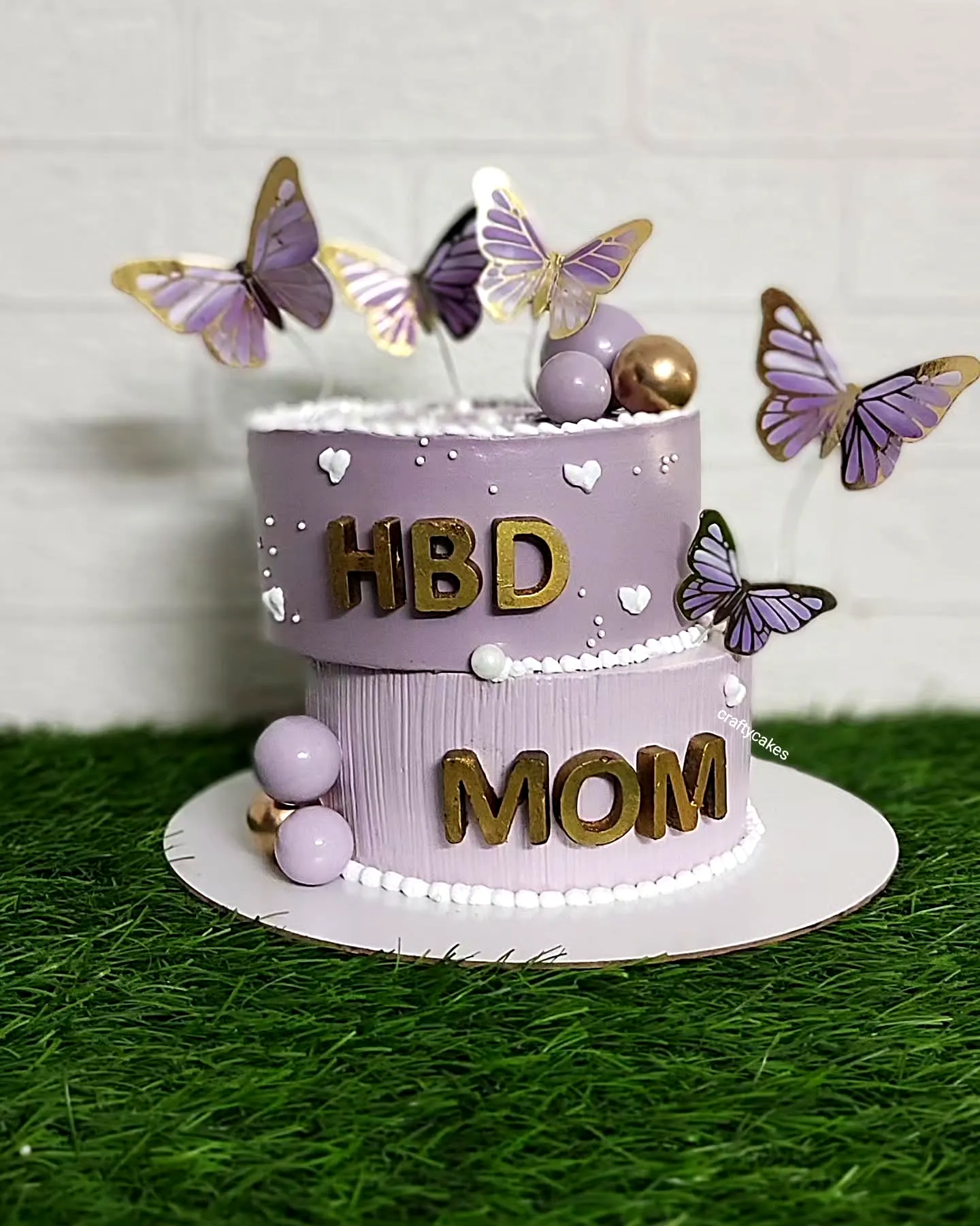Lovely mother birthday cake design with lavender buttercream and whimsical butterflies