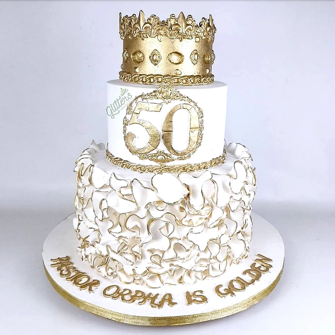 Luxurious 50th Birthday Cake for Women with Gold Accents and Ruffles