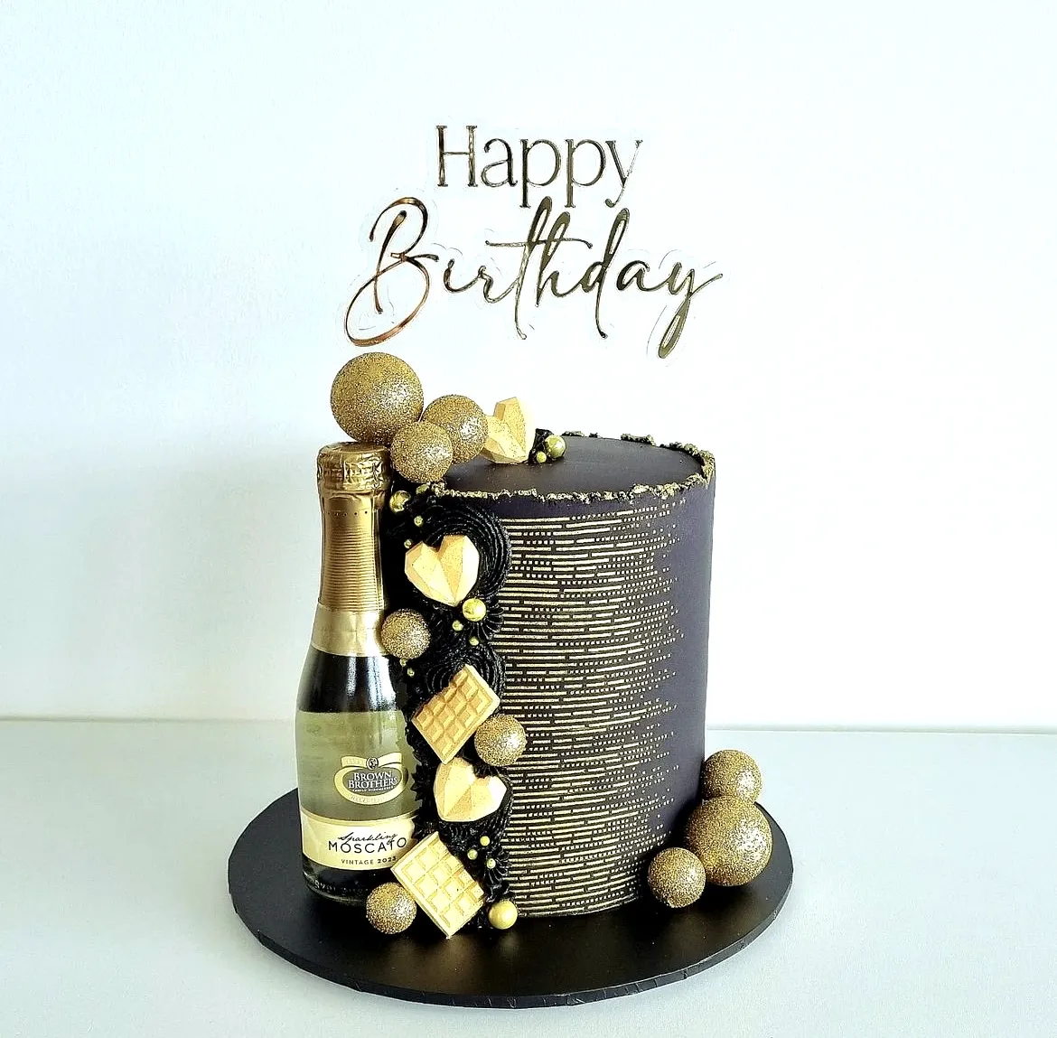 Stunning Black Birthday Cake with Gold Accents for a Modern Celebration