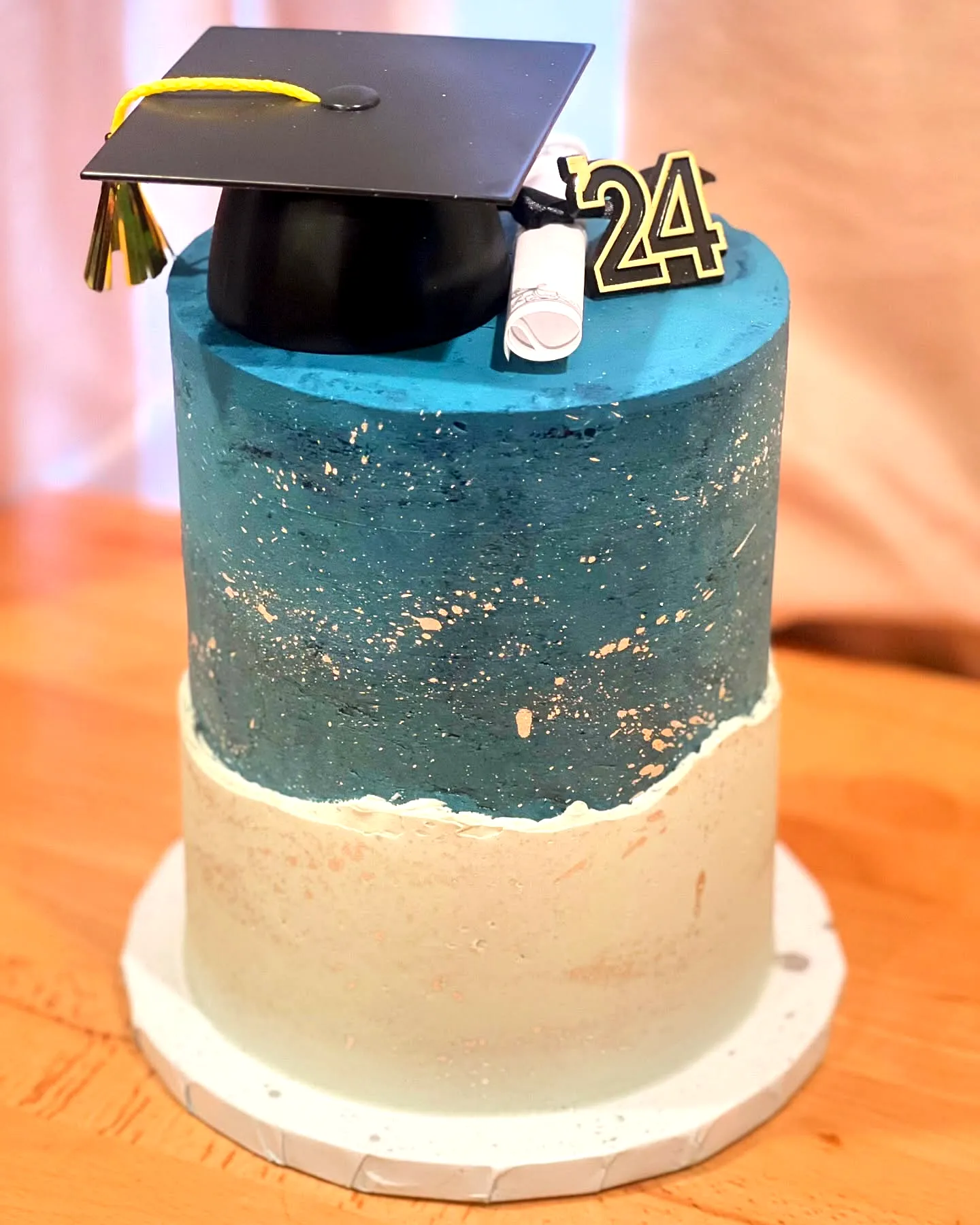 Stylish Blue and Gold Graduation Cake for a Trendy Celebration