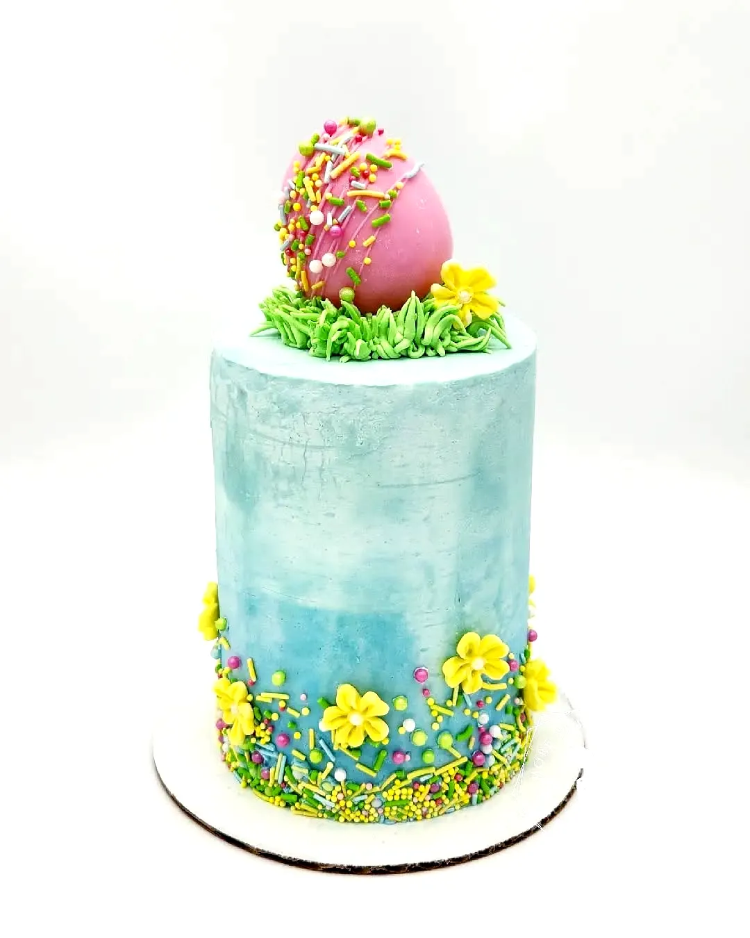 Sweet Buttercream Easter Cake Design with Pastel Colors and Floral Accents