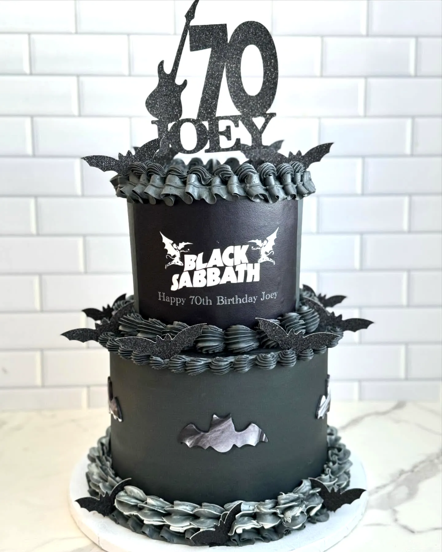 Trendy 70th Birthday Cake Design with Heavy Metal Flair