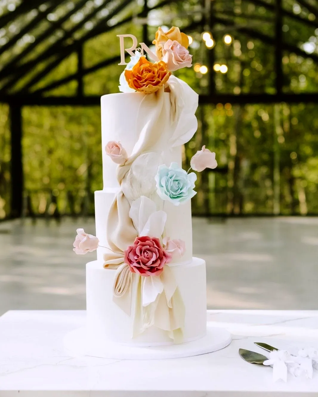 Trendy Contemporary Wedding Cake Design with Sugar Flowers and Modern Elegance