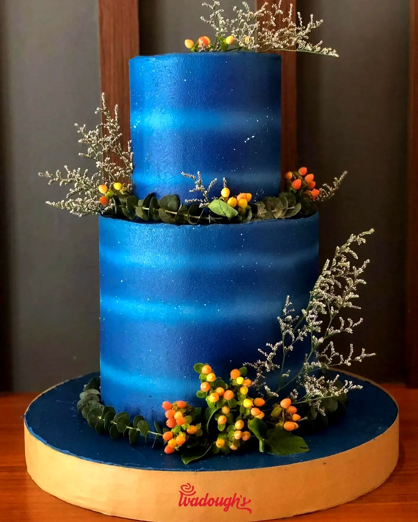 Trendy Contemporary Wedding Cake with Blue Ombre and Elegant Decor
