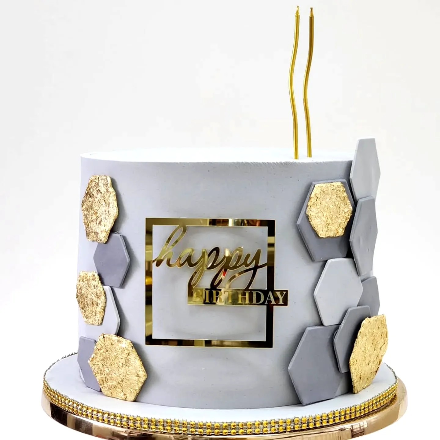 Trendy Golden Birthday Cake Design with Modern Rosette and Geometric Accents